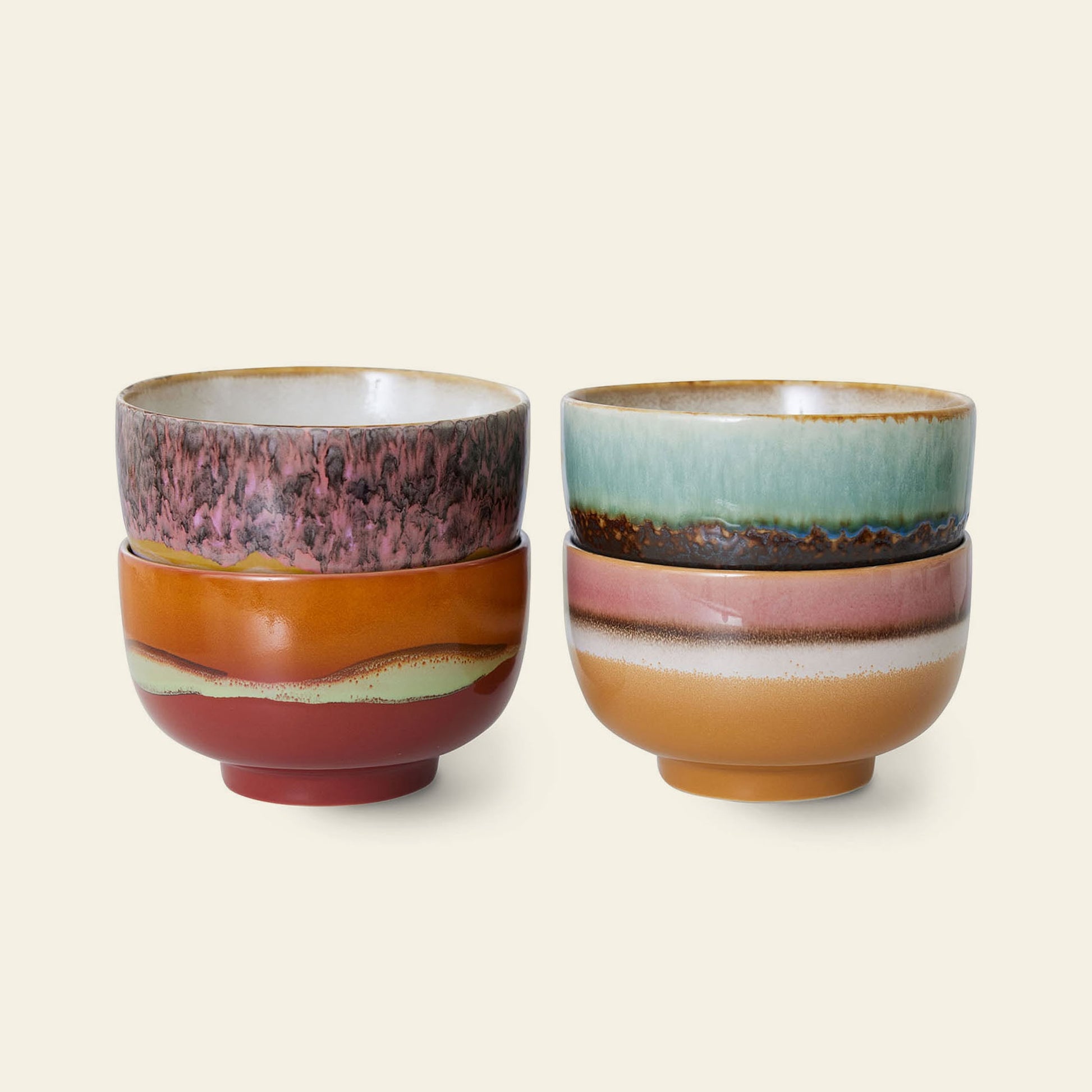 The HKliving 70s Ceramics: Noodle Bowls, Set of 4 showcases colorful, textured glazes in vibrant tones—perfect for serving your favorite dishes against a plain light background.