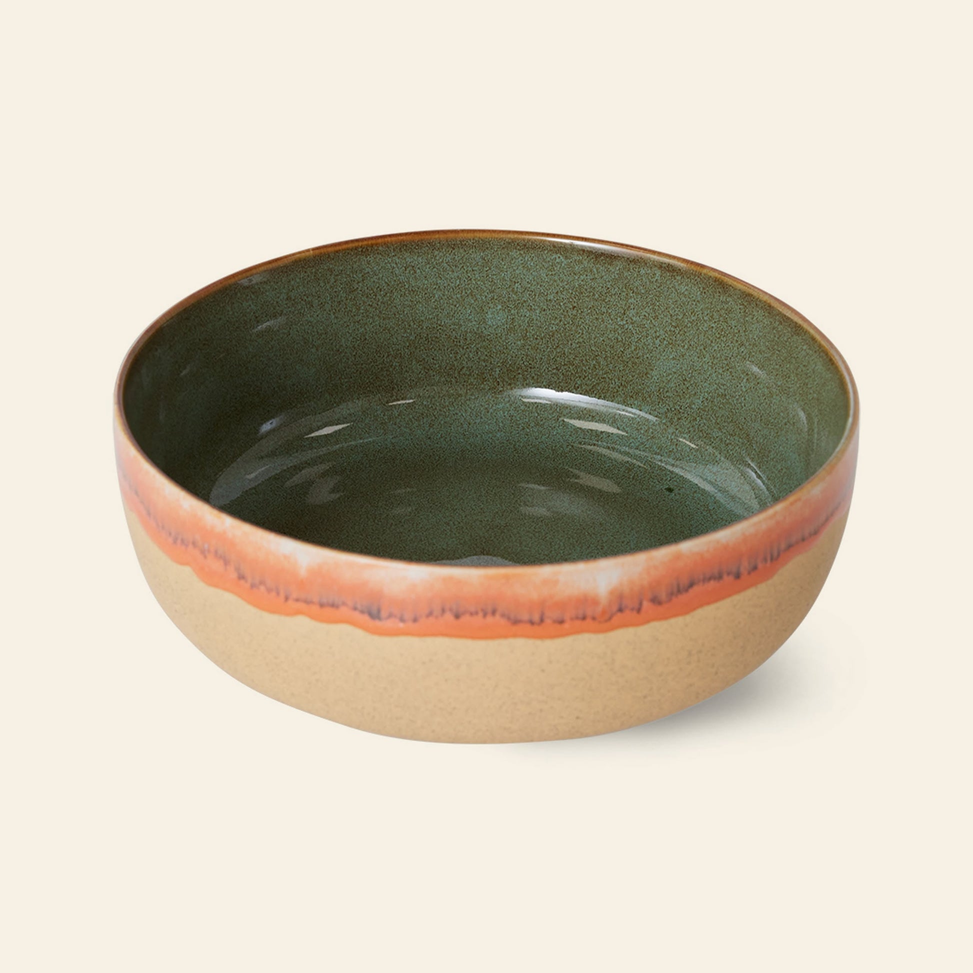 The HKliving 70s Ceramics: Salad Bowl by HKliving features a spacious design with a matte tan exterior, glossy green interior, and an orange accent rim, bringing retro charm to any setting.