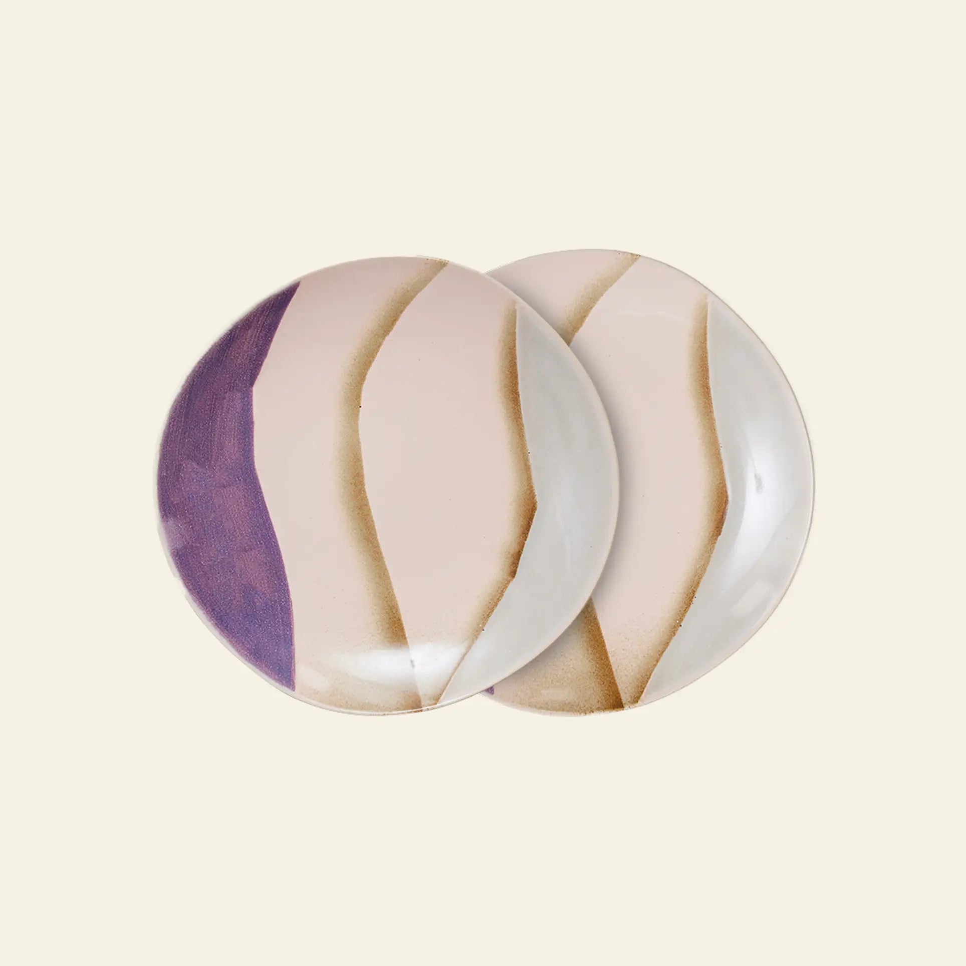 The HKliving 70s Ceramics: Side Plates, Set of 2 by HKliving features two round ceramic plates with abstract wavy designs in beige, light pink, brown, and purple, overlapping on a cream background—imperfect yet charming.