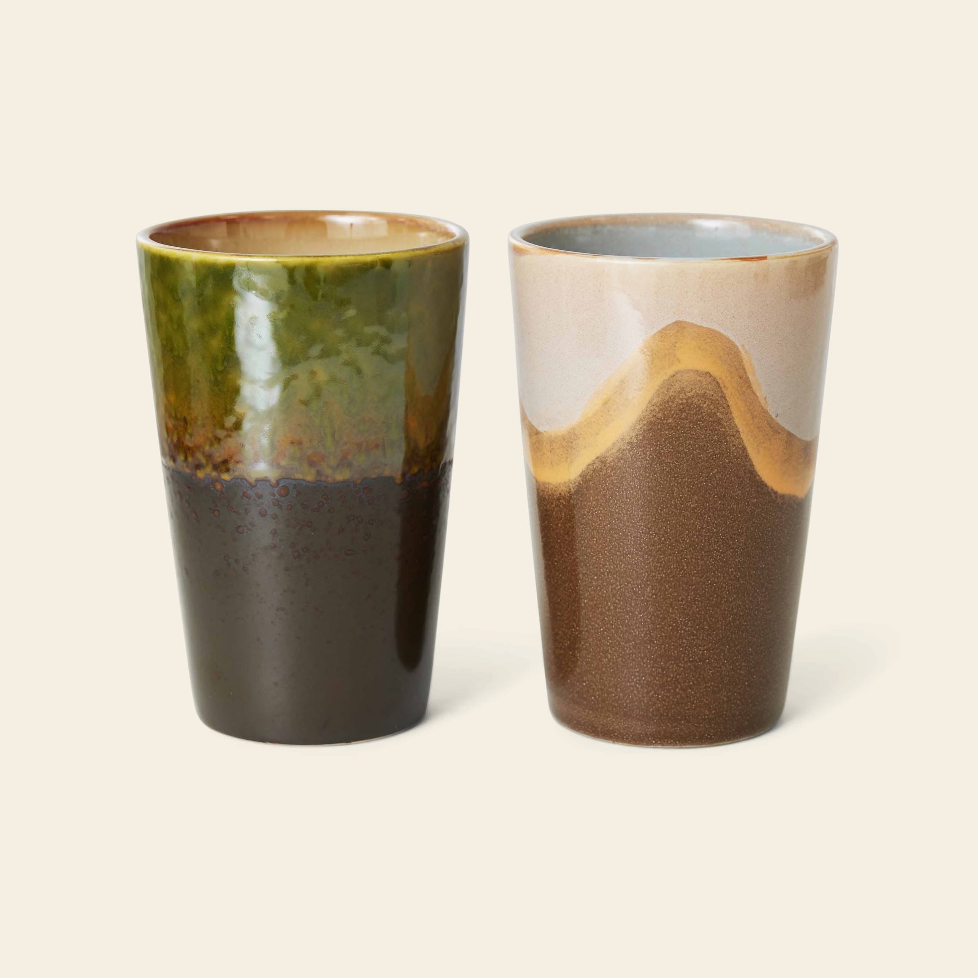 HKliving 70s Ceramics: Tea Mugs, Set of 2—one mug features green and brown glaze, the other beige, tan, and brown waves—each brings a unique retro flair to your tea moments. Brand: HKliving.