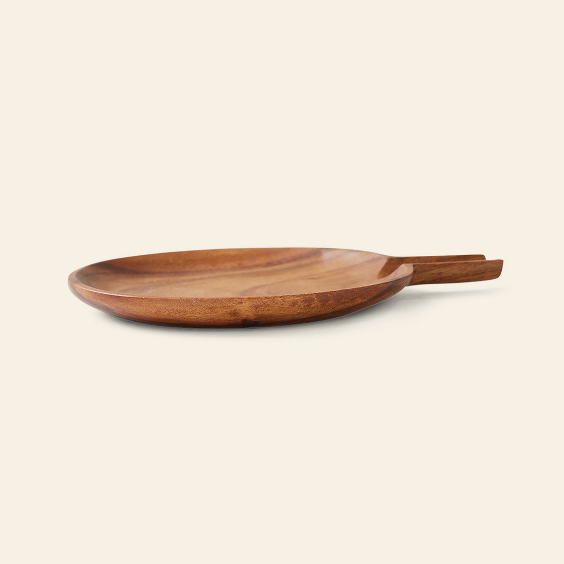The HKliving Acacia Platter L by HKliving is a round, shallow serving plate with a rectangular handle, ideal for use as stylish serveware or a cheese platter, displayed on a simple light background.
