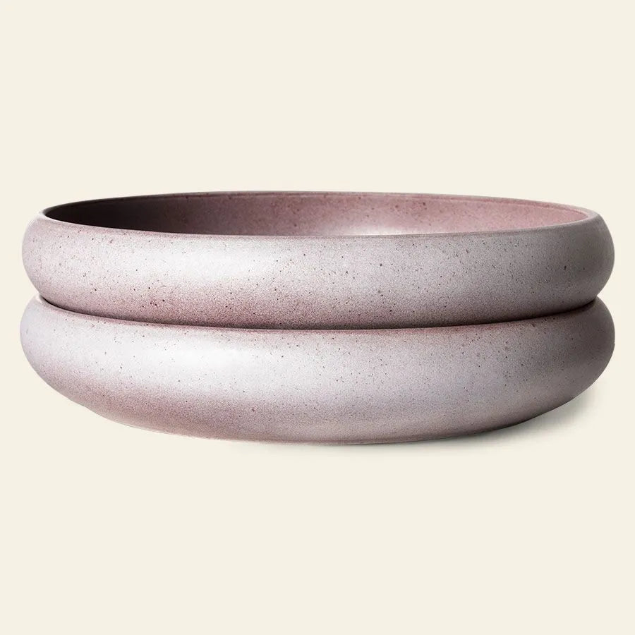 The HKliving Bold & Basic Ceramics: Deep Plate, Set of 2 features minimalist, round ceramic bowls in matte light mauve with thick rims—modern pieces that showcase elegant purple ceramics for stylish culinary presentations.