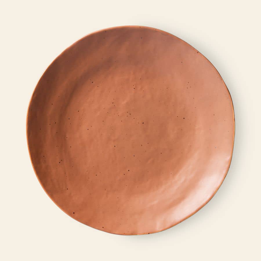 The HKliving Bold & Basic Ceramics Side Plate, Set of 2, features round, handmade terracotta plates with smooth matte finishes and slightly uneven edges, shown against a light beige background.