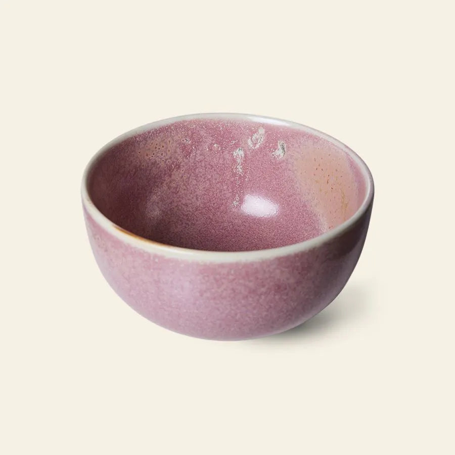 The HKliving Chef Ceramics: Bowl is a round ceramic piece with a glossy pink reactive glaze and subtle speckles, featured as part of the HKliving tableware essentials collection and shown against an off-white background.
