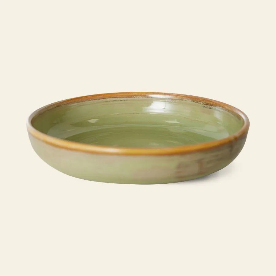 The HKliving Chef Ceramics: Deep Plate M is a round ceramic bowl with artisanal charm, featuring a glossy olive green interior, brown rim, and shown on a plain light beige background.