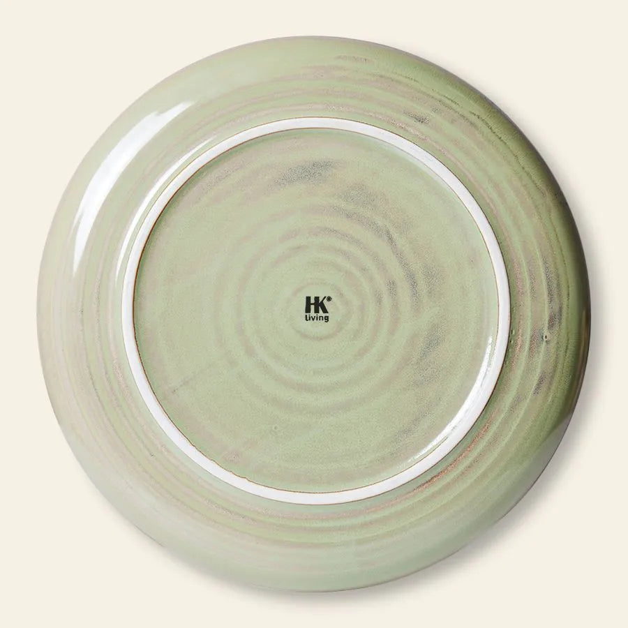 The HKliving Chef Ceramics: Dinner Plate features a round design, light green marbled glaze, and smooth finish. An essential tableware piece from HKliving, it includes the brand logo in black on the underside.