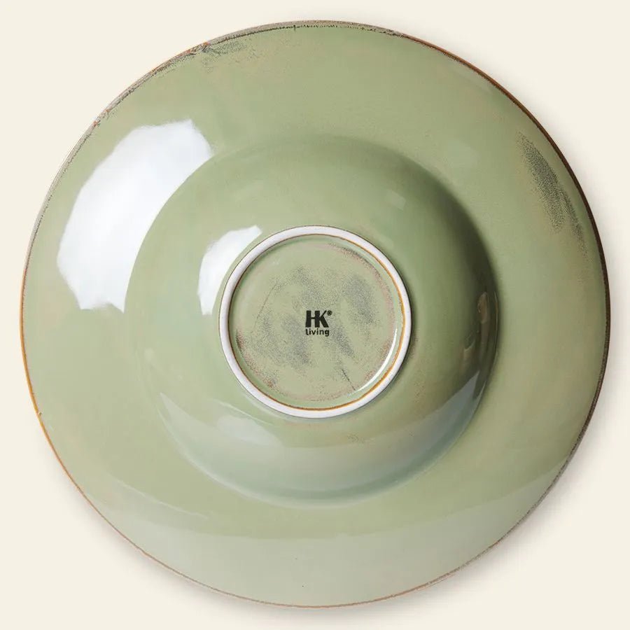 The HKliving Chef Ceramics Pasta Plate is a large, round, light green ceramic plate with a white ring on the base and HKliving branding at the center. Its slightly worn edges give a rustic touch—perfect for your tableware collection.