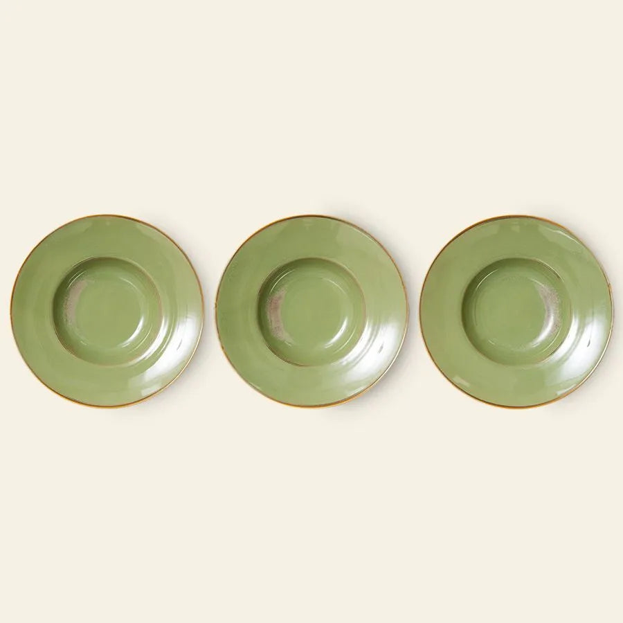 Three green HKliving Chef Ceramics: Pasta Plates with a brown rim are arranged on a beige background, highlighting these stylish essentials by HKliving—perfect as a pasta plate set for everyday dining.