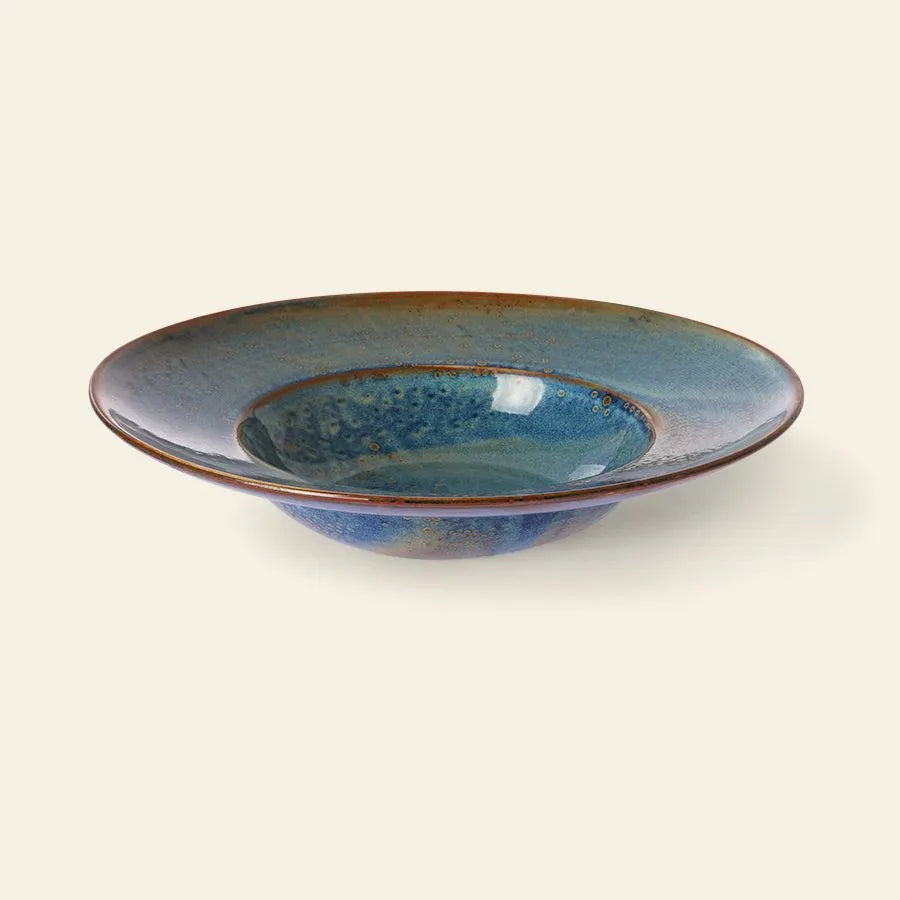 The HKliving Chef Ceramics Pasta Plate features a handmade, wide, shallow design with a glossy blue-green glaze and brown rim—an elegant tableware essential by HKliving. Photographed on a light beige background.