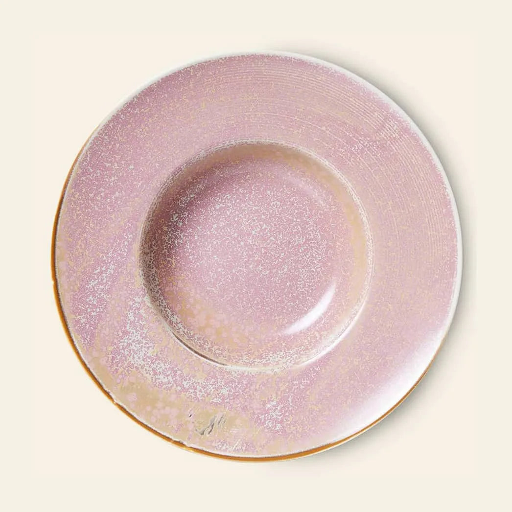 The HKliving Chef Ceramics: Pasta Plate is a round, shallow plate with a pink speckled glaze, slightly raised rim, and glossy finish—an essential tableware piece from HKliving—set against a light beige background.