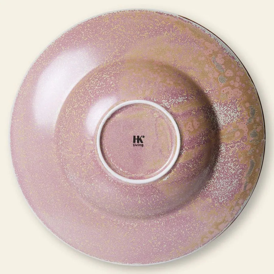 The HKliving Chef Ceramics: Pasta Plate is a pink ceramic plate with a speckled, textured glaze, central indent, and the HKliving logo in black—an elegant tableware choice. Shown photographed from above.