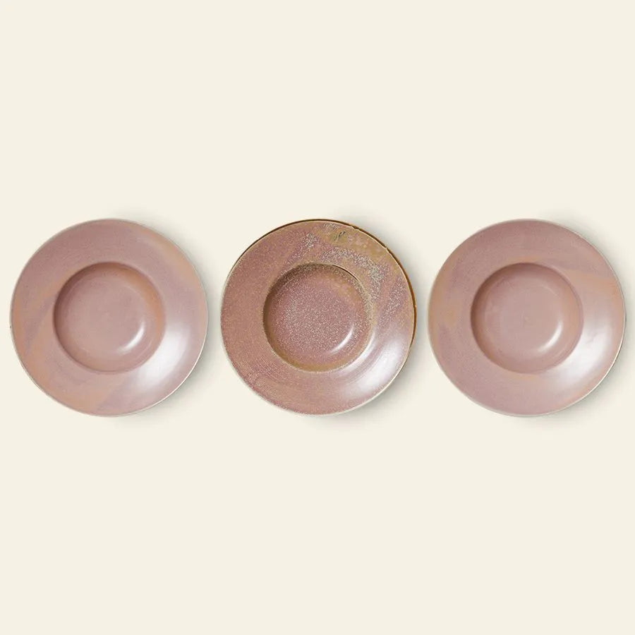 Three HKliving Chef Ceramics Pasta Plates in muted mauve and brownish glaze are arranged side by side on a beige background, with the middle plate featuring a unique texture that sets it apart from these essential tableware pieces.