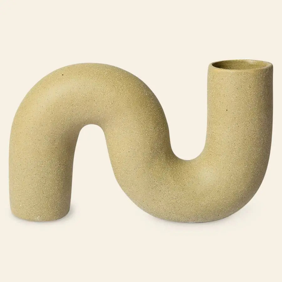 The HKliving HK Objects: Ceramic Twisted Vase features a unique S-shaped beige ceramic design, with one tall open end and a shorter closed end, perfect for adding a sculptural accent to your home decor.