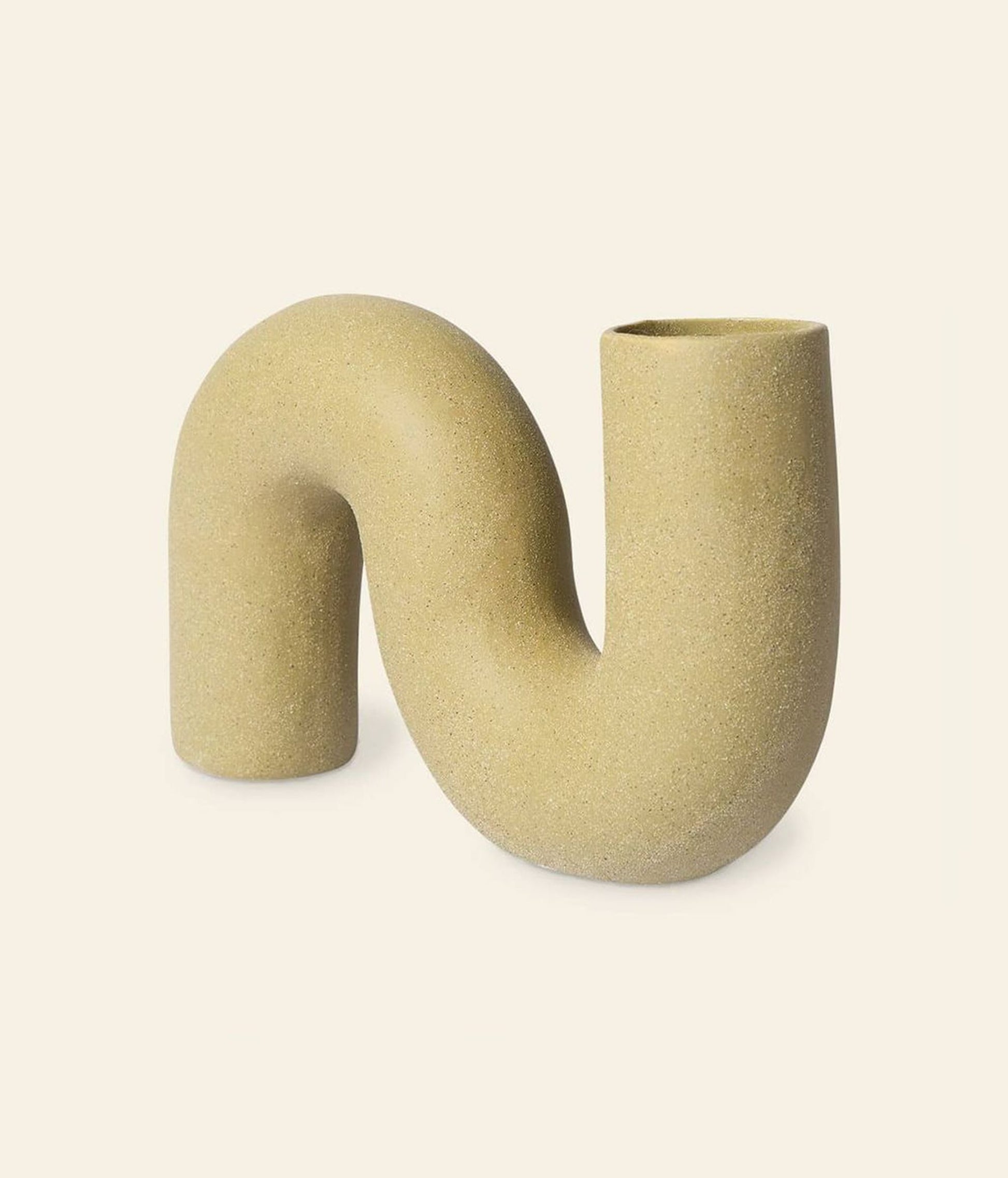 The HKliving HK Objects: Ceramic Twisted Vase features a beige matte ceramic finish, sculptural S-shaped design, and two open ends—an eye-catching modern accent for your decor. Stands upright against a plain background.