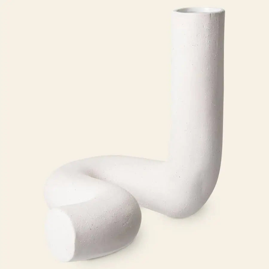 The HKliving HK Objects: Ceramic Twisted Vase by HKliving features a modern, sculptural design with a curved, twisted form—an eye-catching home decor piece shown on a simple beige background.