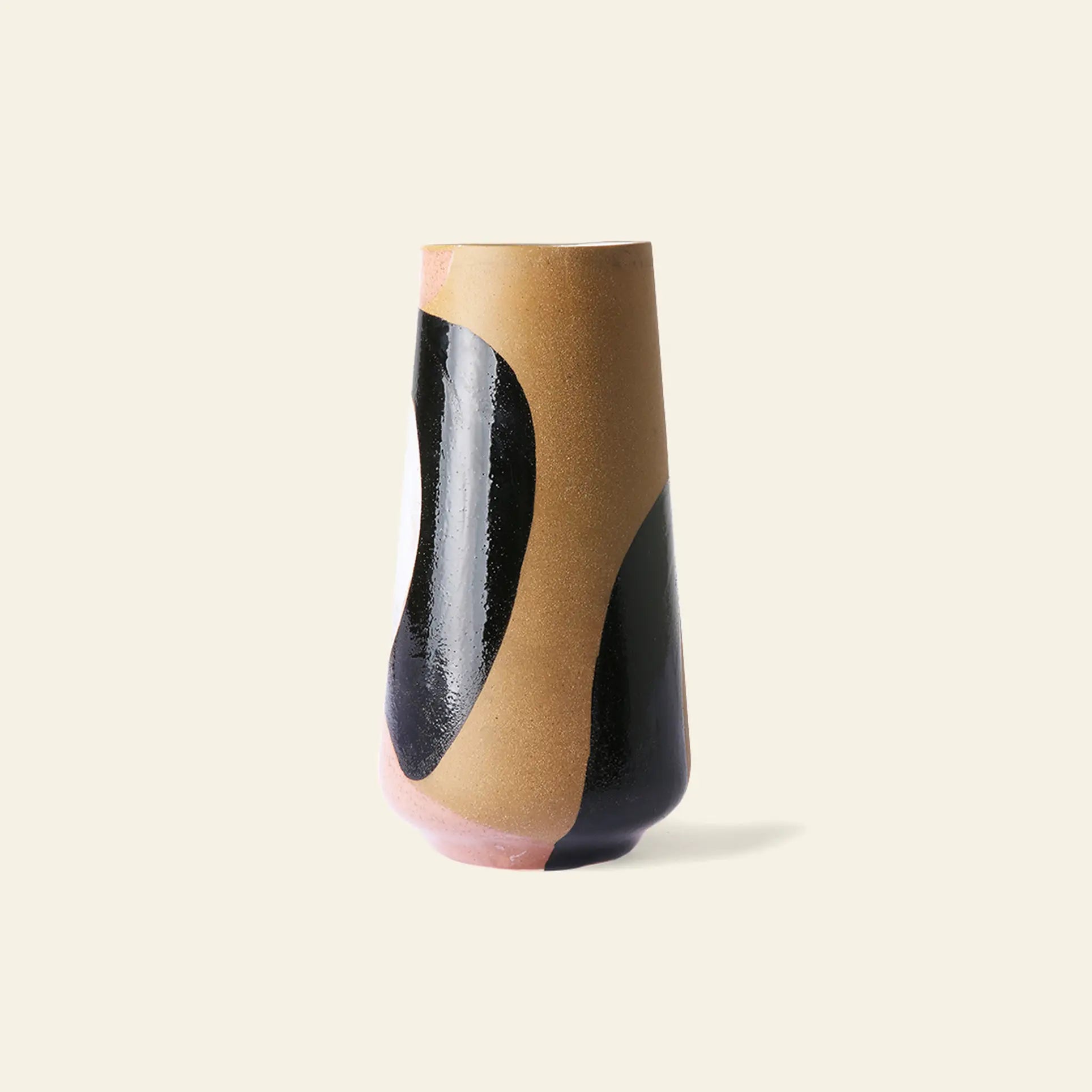 The HKliving Hand Painted Ceramic Flower Vase by HKliving features a tall, cylindrical design with a flared top and glossy finish, decorated with abstract curved color blocks in black, tan, and pink—a striking centerpiece for any beige background.