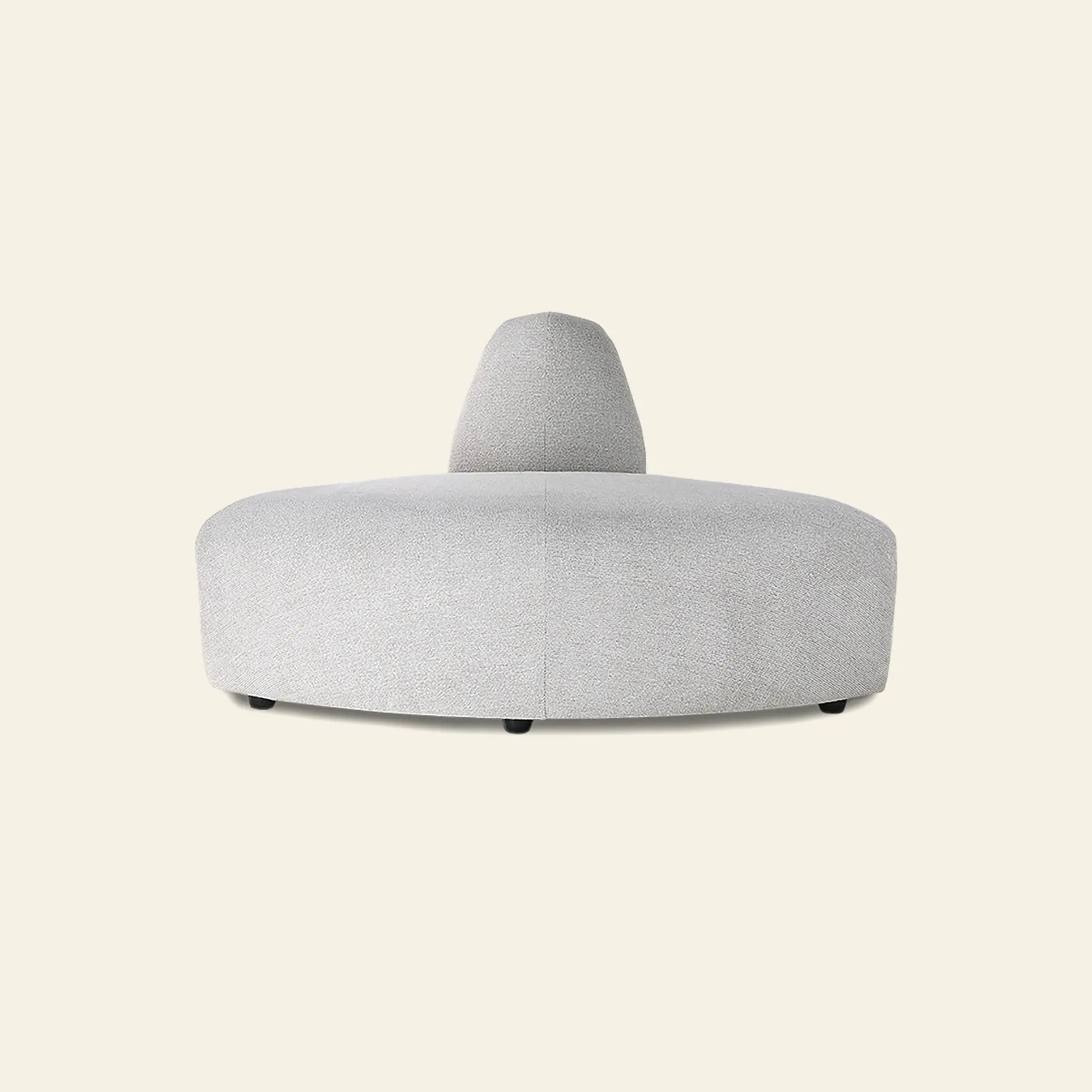 The HKliving Jax Couch, Angle by HKliving features a modern circular gray upholstered design with a curved central backrest, highlighted against a plain off-white background.