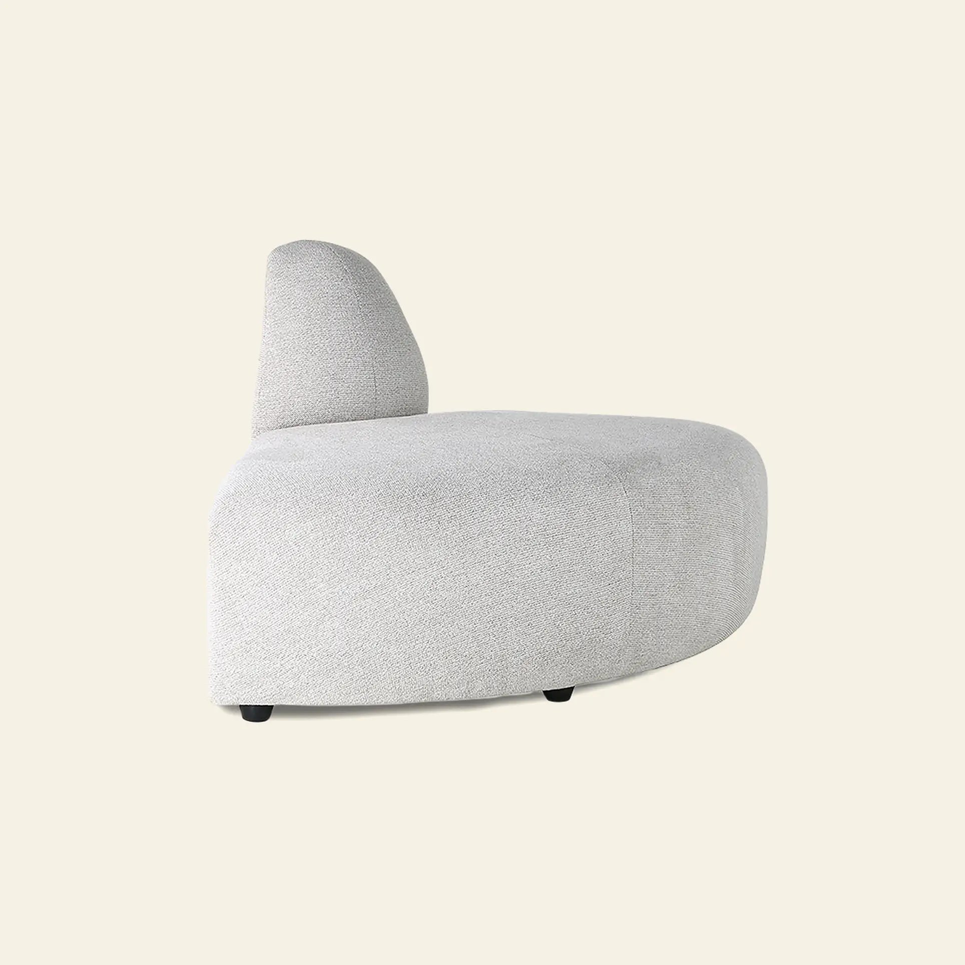 The HKliving Jax Couch, Angle by HKliving features a curved, modern light gray upholstered design with a rounded backrest and no visible armrests, perfect for striking arrangements against a plain light background.