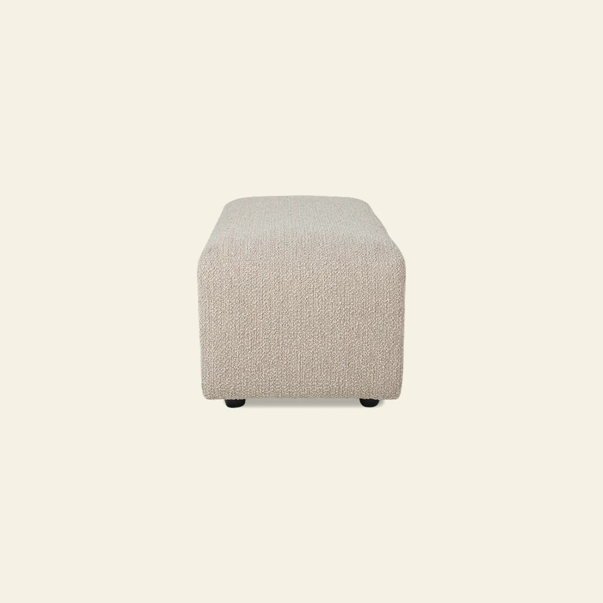 The HKliving Jax Couch, Hocker Small by HKliving is a rectangular, light beige upholstered ottoman with textured fabric, shown from the front on an off-white background, and can be easily paired with other Jax elements for stylish arrangements.