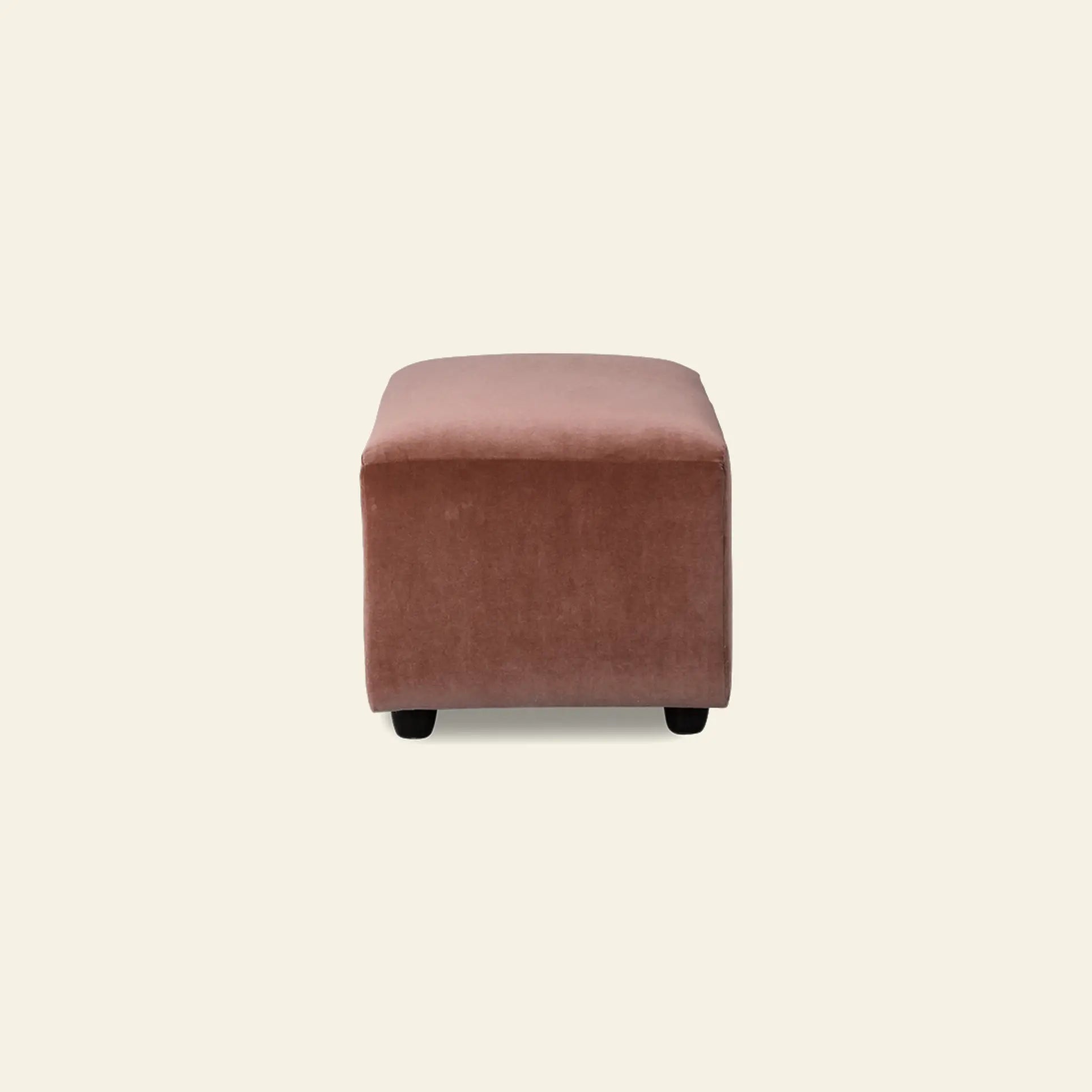 The HKliving Jax Couch, Hocker Small by HKliving is a square pink velvet ottoman with short black legs, adding versatile style to any space and pairing effortlessly with other Jax elements.