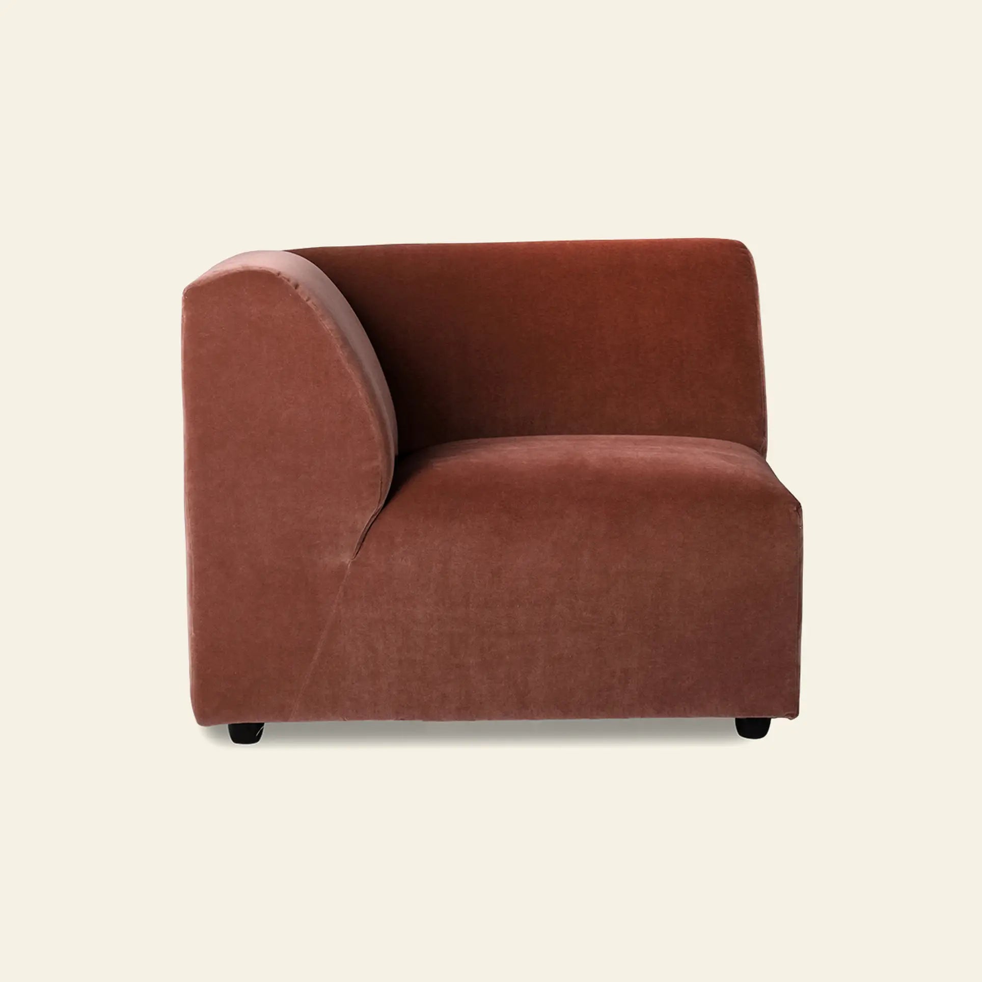The HKliving Jax Couch, Left End by HKliving features a modern design with a curved backrest and soft rust-colored upholstery, standing out against a light beige background.