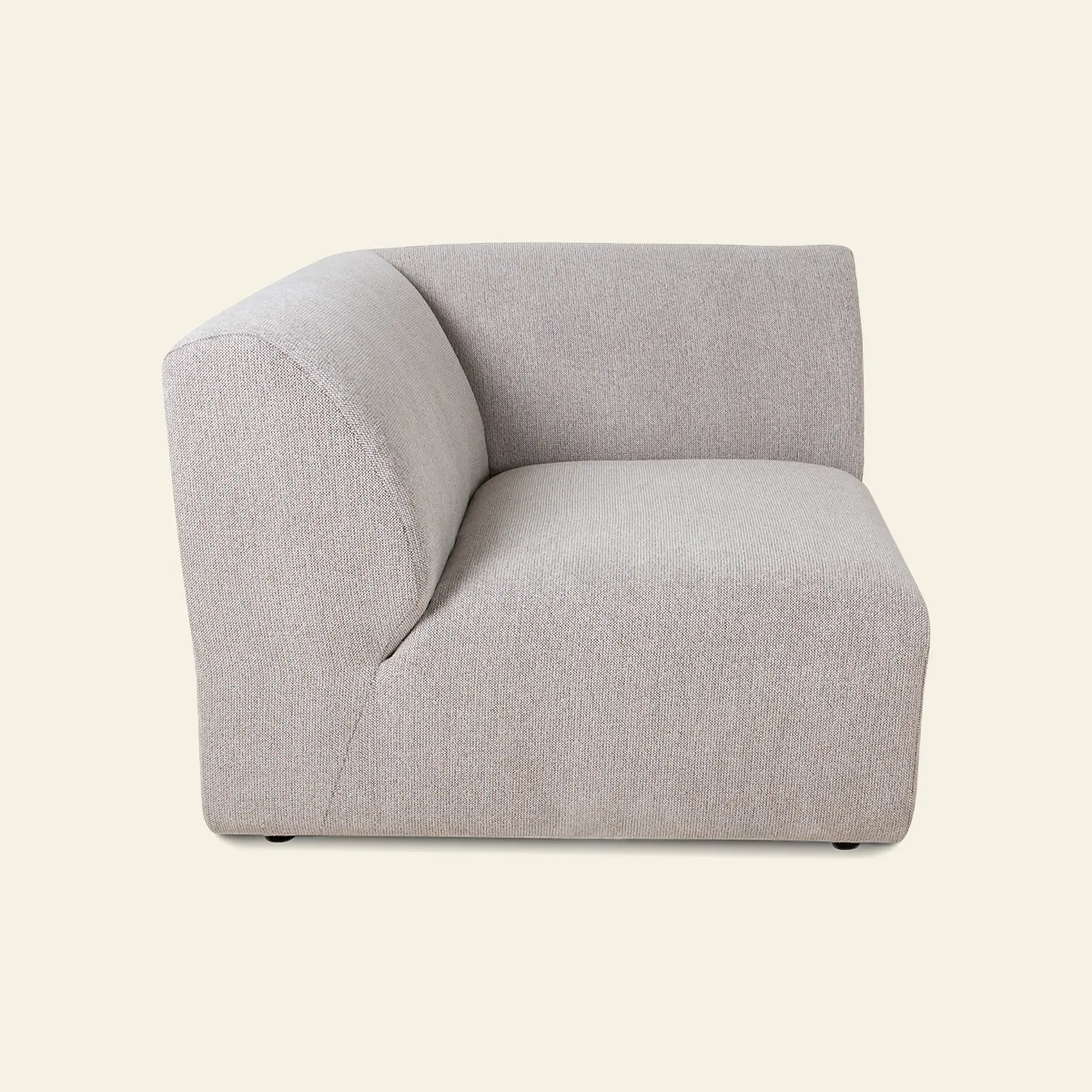 The HKliving Jax Couch, Left End by HKliving is a modern light gray upholstered corner sofa chair with a clean, minimalist design, displayed from the side against a plain beige background.