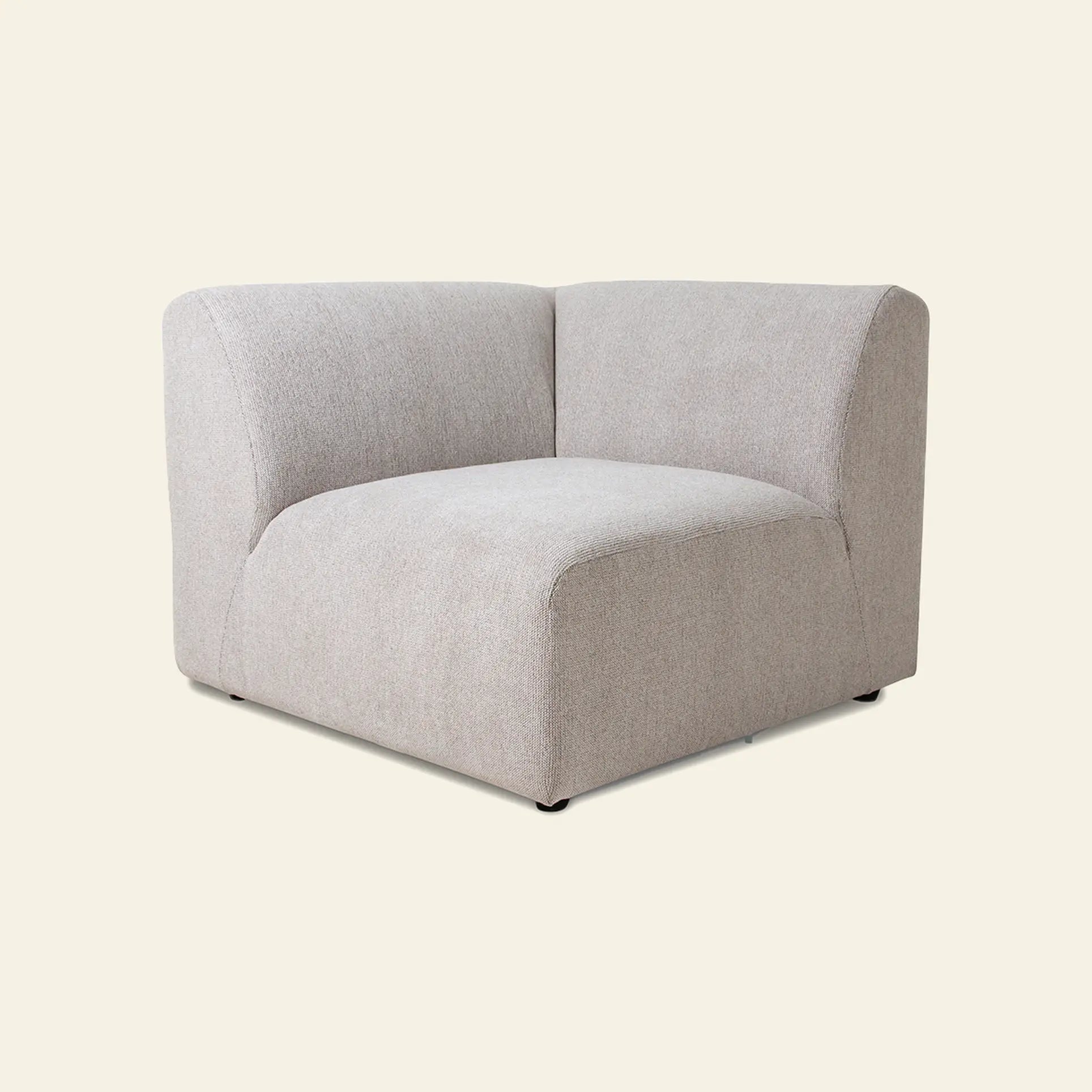The HKliving Jax Couch, Left End, by HKliving features a modern, light gray upholstered design with soft, rounded edges and minimalist style, highlighting comfort and versatility against a plain beige background.