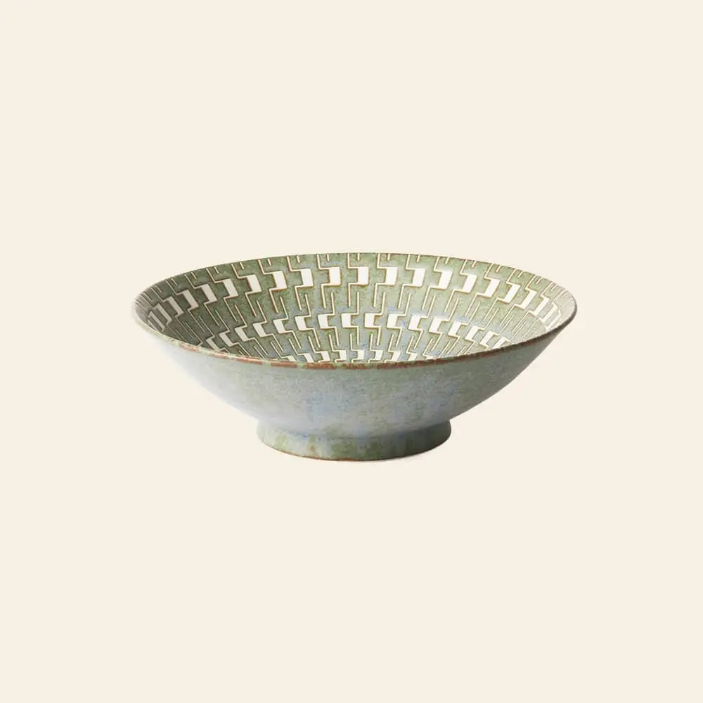 The HKliving Kyoto Ceramics Japanese Ceramic Salad Bowl features a wide rim and green and cream geometric pattern inside, displayed against a plain beige background.