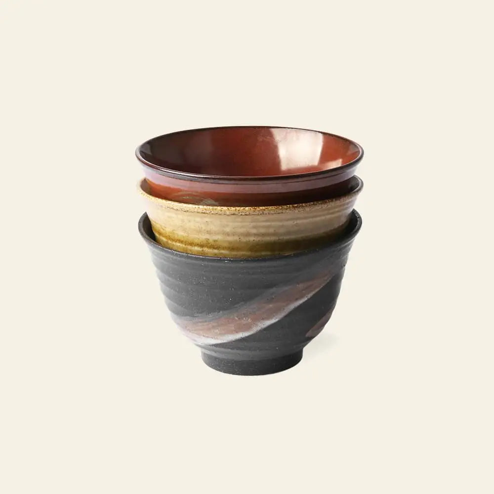 The HKliving Kyoto Ceramics Japanese Matcha Bowls Set includes three stacked bowls in earthy glazes—reddish-brown, glossy tan, and dark gray with swirls—crafted by HKliving and inspired by traditional Kyoto ceramics.