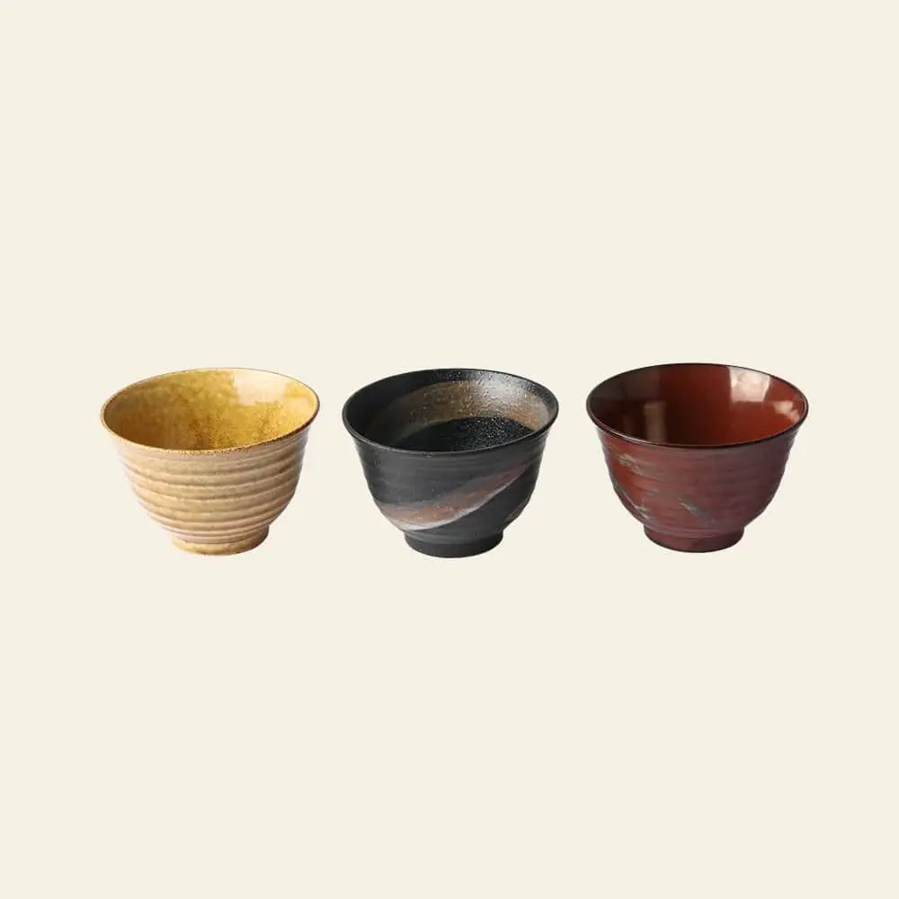 HKliving Kyoto Ceramics: Japanese Matcha Bowls, Set of 3—yellow ribbed, black swirl, and glossy dark brown—are beautifully arranged on a neutral background, perfect for tea ceremonies or lovers of Kyoto ceramics.