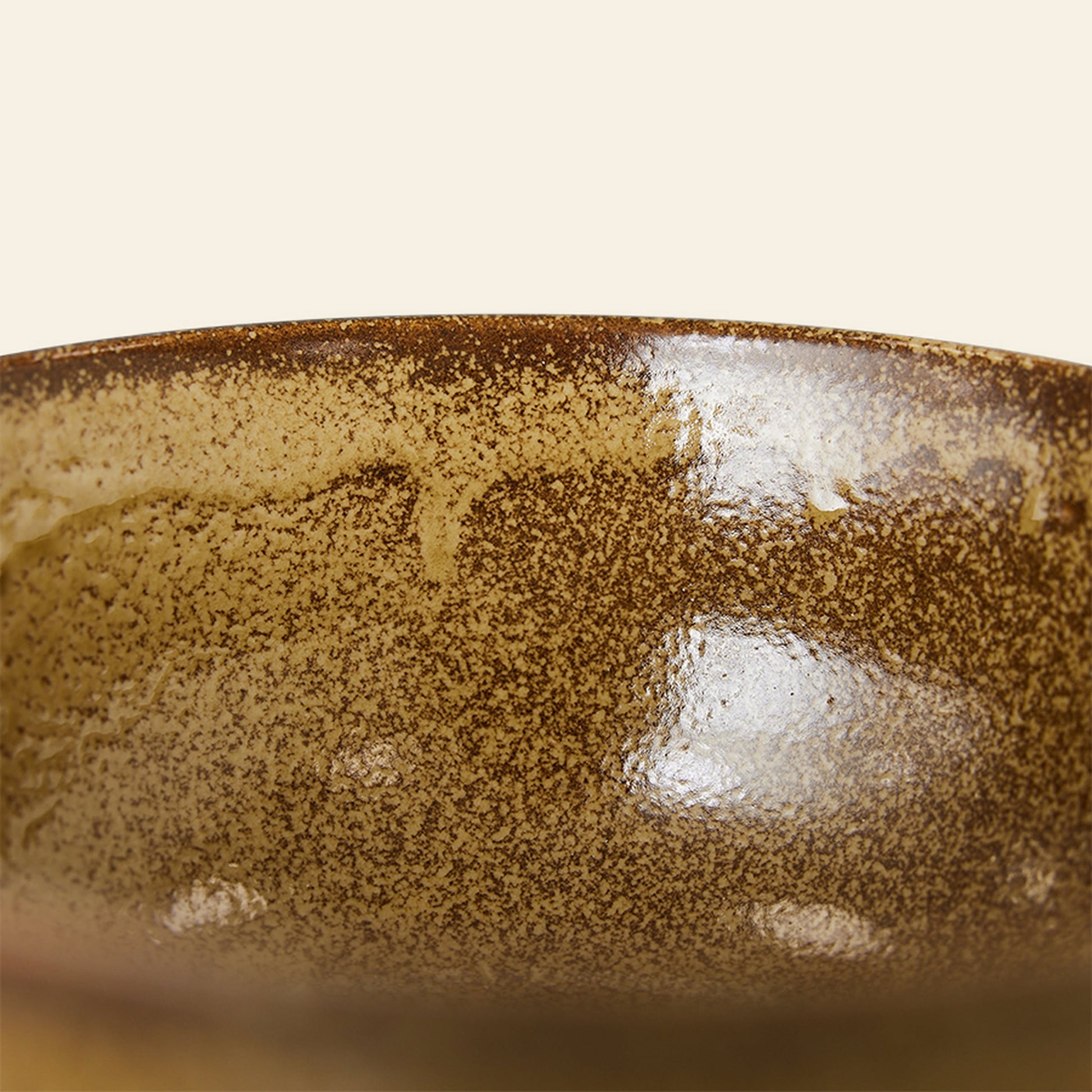 Close-up of the rim of an HKliving Kyoto Ceramics Japanese Noodle Bowl, set of 4, featuring a glossy, speckled brown and tan glaze. The hand-finished surface highlights the textured, artisanal style typical of HKlivings craftsmanship.