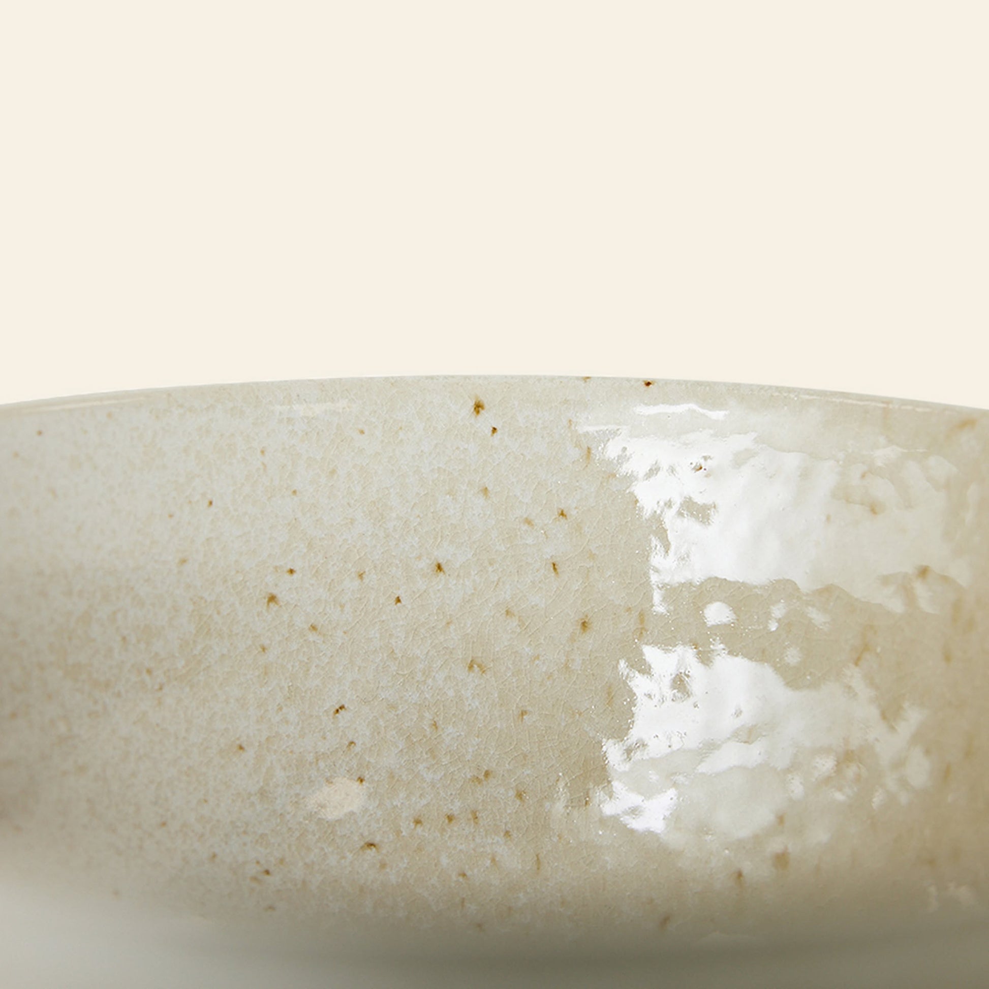 Close-up of an HKliving Kyoto Ceramics Japanese Noodle Bowl, set of 4, featuring hand-finished beige speckled glaze with a glossy surface, inspired by traditional Japanese design—shown against an off-white background.