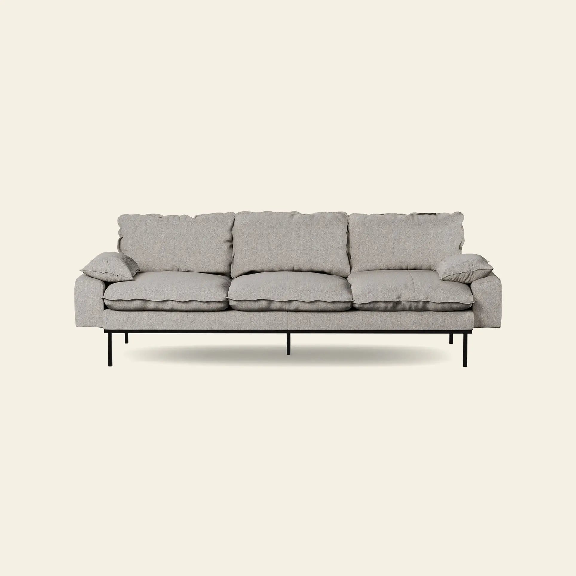 The HKliving Retro Sofa, 4-Seats by HKliving features plush seat and back cushions, slim armrests, and black metal legs—a modern light gray sofa that elevates any living space against an off-white backdrop.