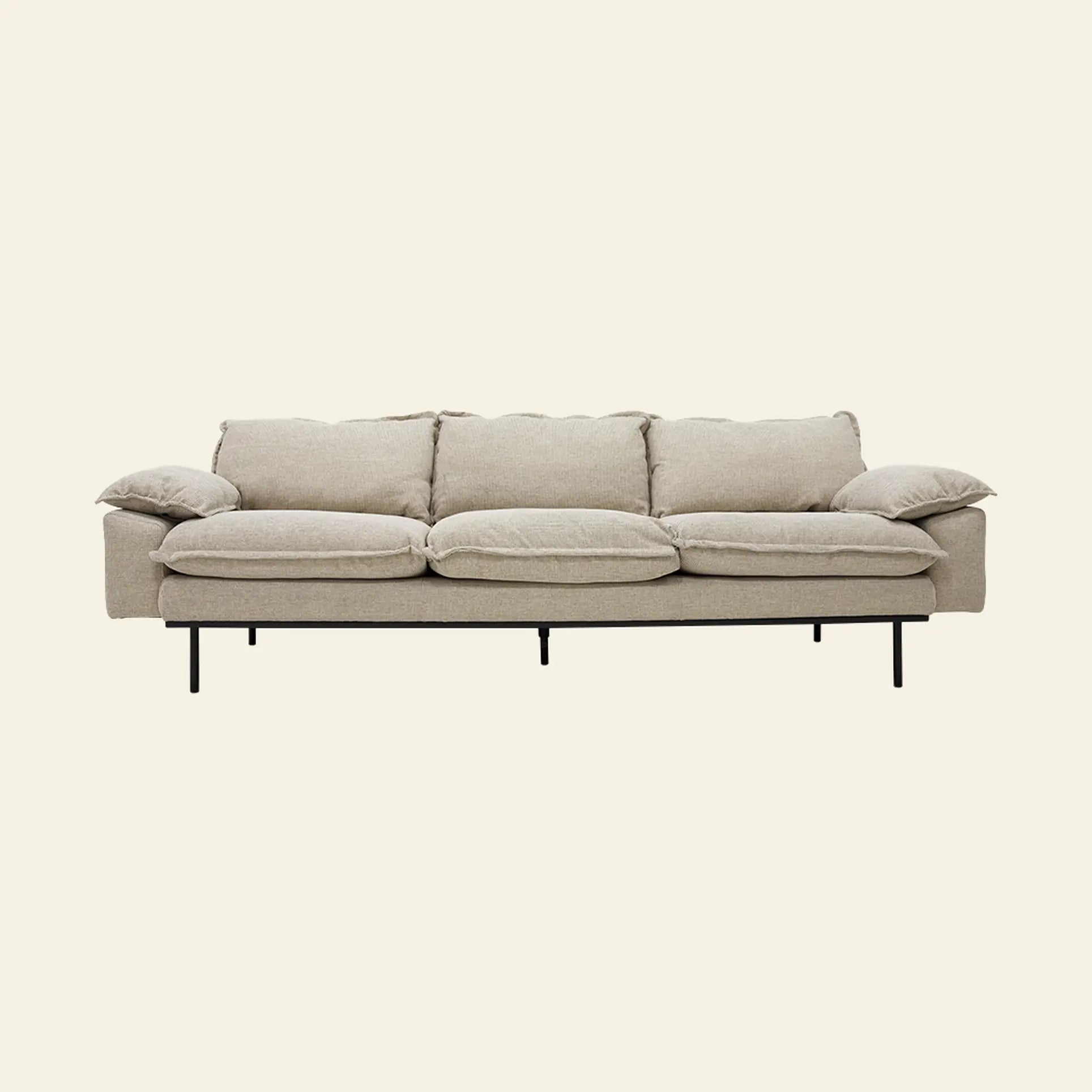 The HKliving Retro Sofa, a modern beige 4-seater with plush cushions and low armrests on slim black metal legs, offers exceptional comfort and style to any living space.