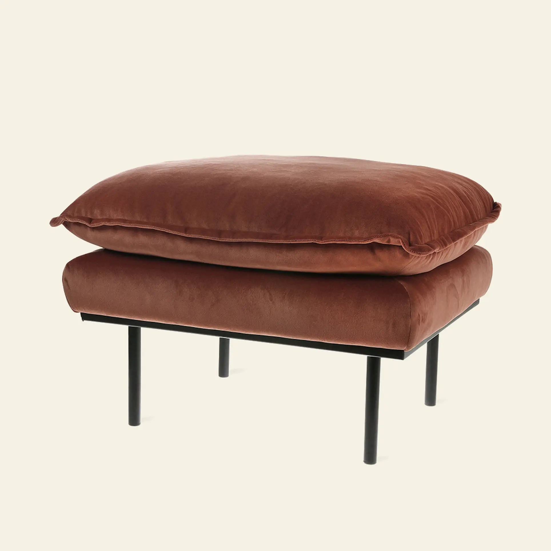 The HKliving Retro Sofa Hocker features a plush rust-colored cushion and slim black metal legs, bringing both comfort and style to any living space against a plain light background.