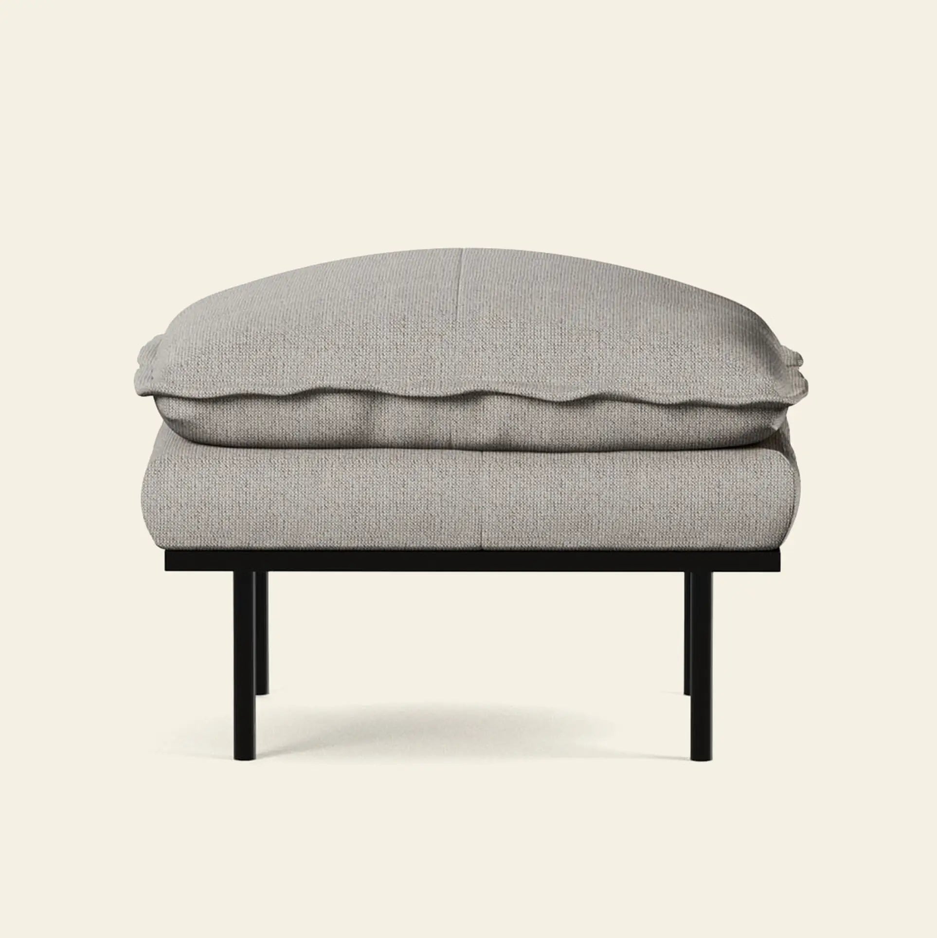 Front view of the HKliving Retro Sofa, Hocker by HKliving, featuring a light gray cushion and sleek black metal frame—a modern, minimalist ottoman that adds comfort and style to any living space against an off-white background.