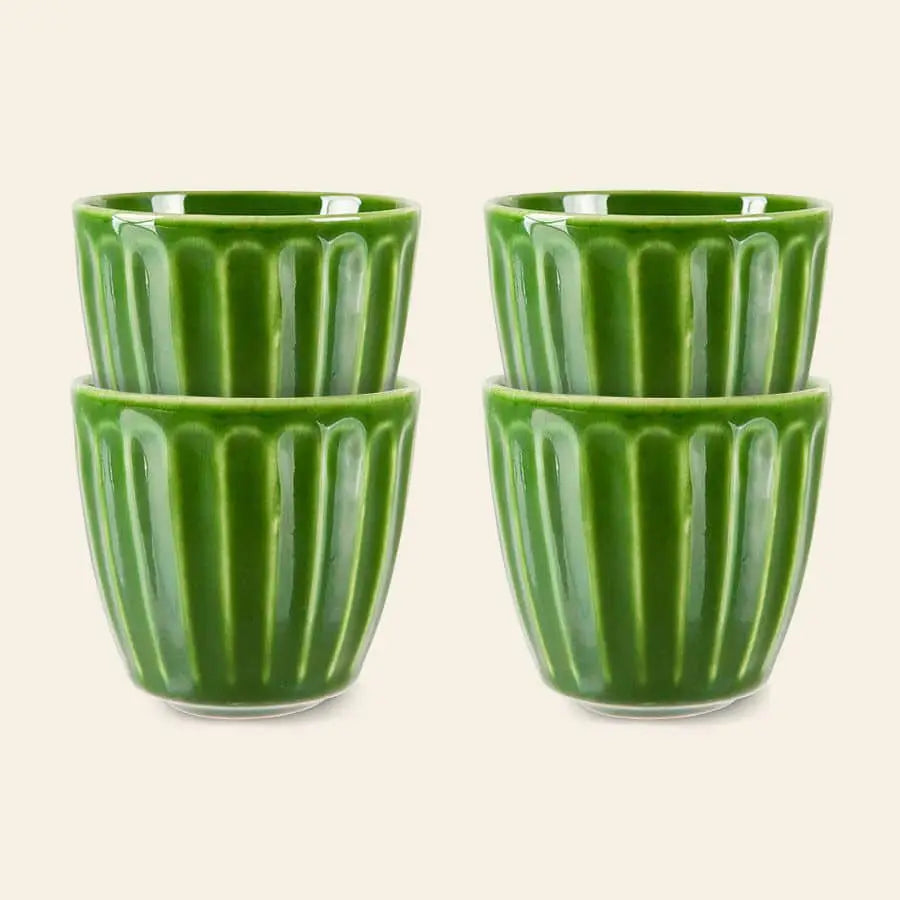 The HKliving The Emeralds: Ceramic Mug Ribbed set includes four green ceramic mugs stacked in pairs against a light background—a stylish addition to any coffee lover’s collection.