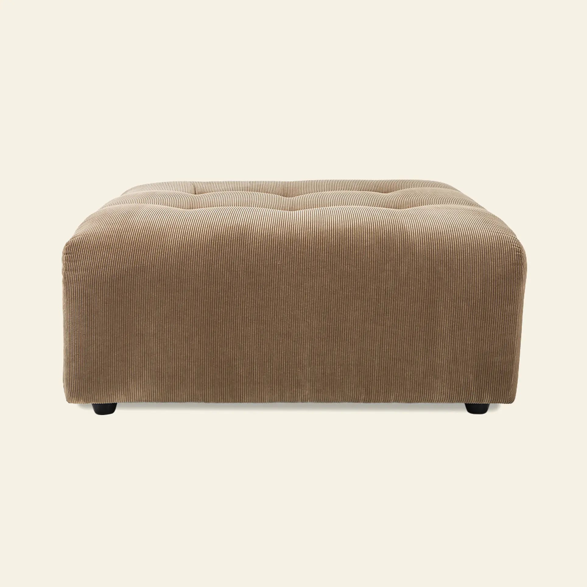 The HKliving Vint Couch Hocker, a large rectangular light brown corduroy ottoman with tufted top, perfectly complements HKlivings Vint sofa collections, providing customizable seating against an off-white backdrop.