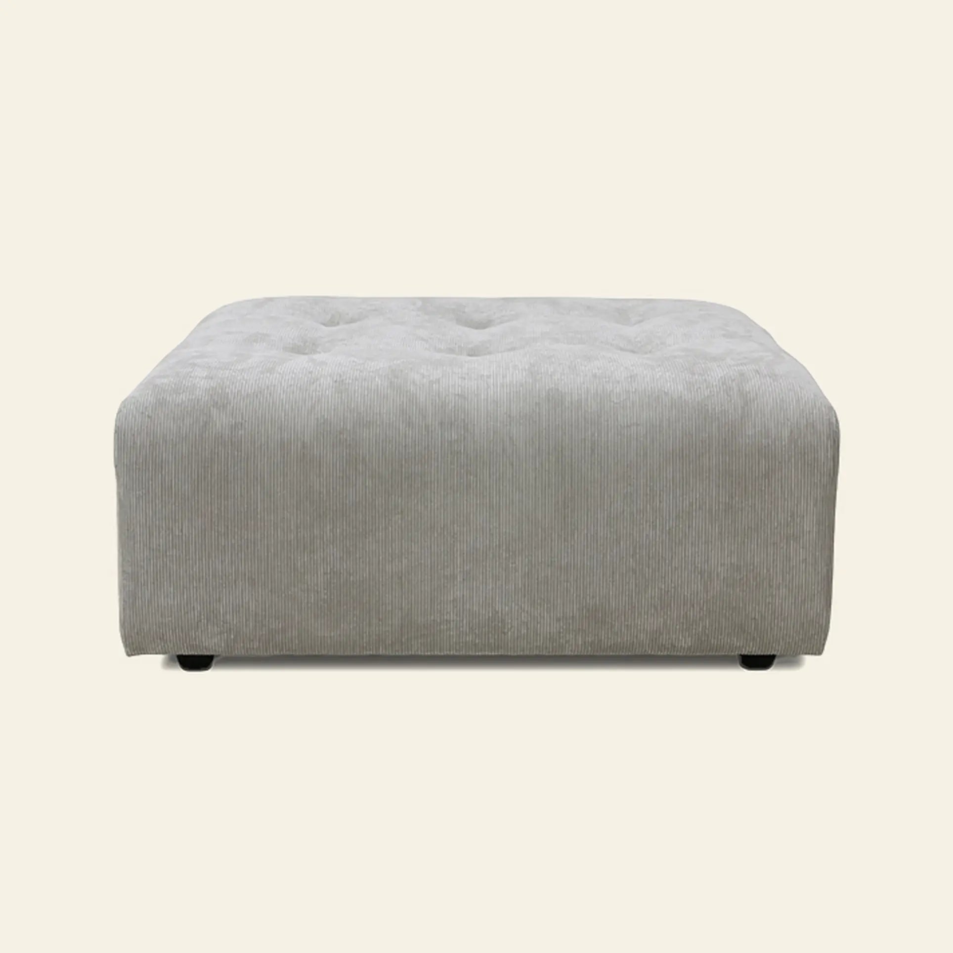 The HKliving Vint Couch, Hocker by HKliving is a large, square, light gray upholstered ottoman with textured fabric and button tufting, designed to complement Vint sofa components. Shown on a plain beige background.