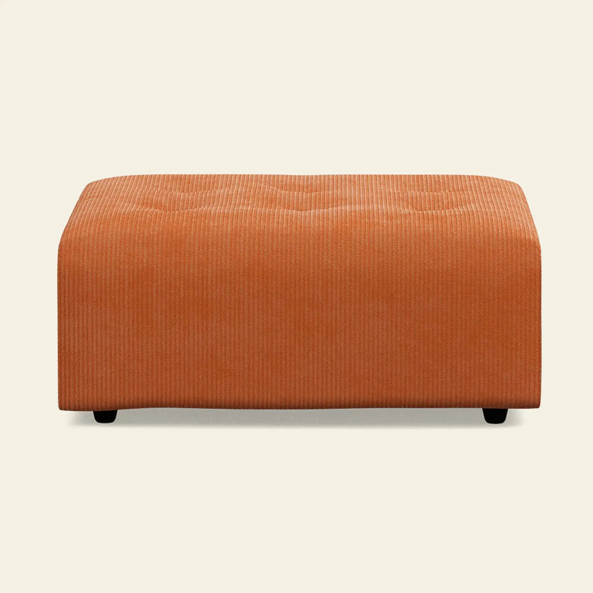 The HKliving Vint Couch, Hocker—a rectangular orange corduroy ottoman with short black legs—offers customizable seating or pairs well with the Vint sofa, shown here against a plain light background.
