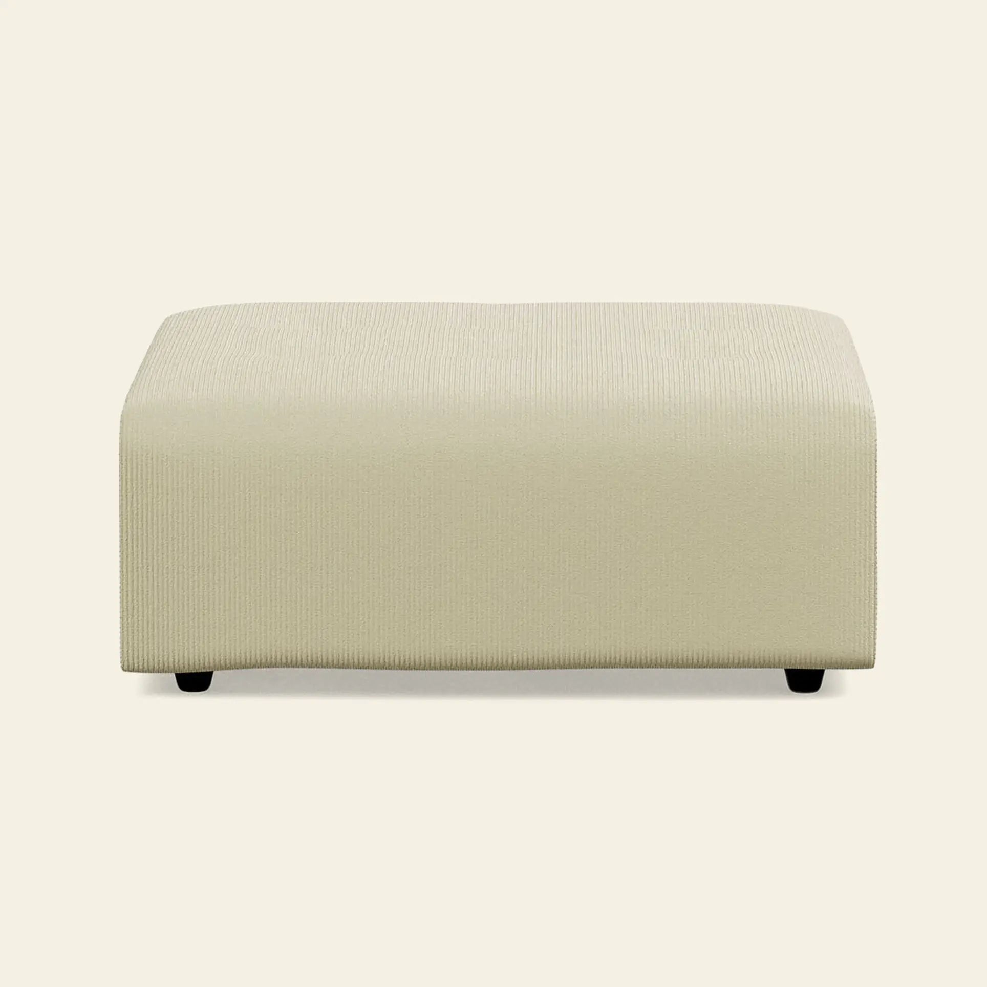 The HKliving Vint Couch Hocker features a rectangular shape, light beige textured fabric, low black feet, and modern lines—ideal for customizable seating or as a stylish addition to your Vint sofa.