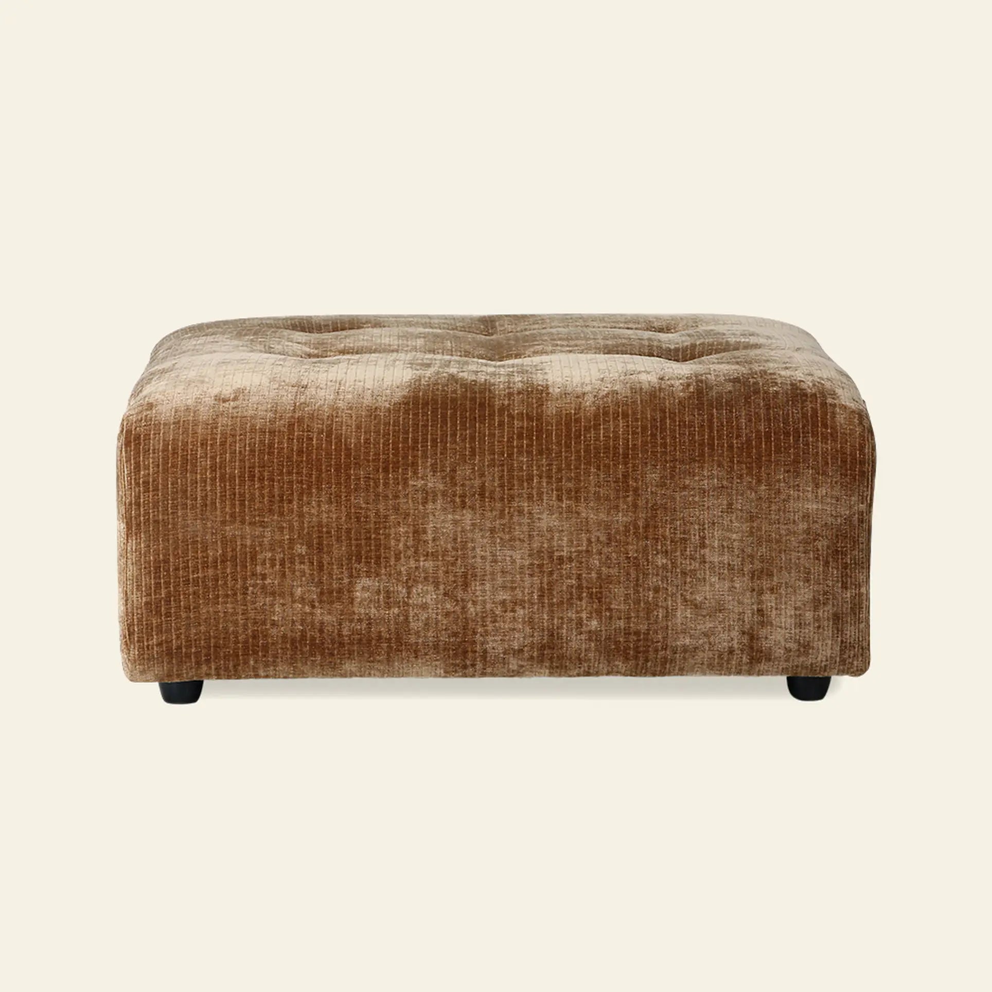 The HKliving Vint Couch Hocker is a rectangular, tufted ottoman in light brown textured fabric with short dark legs, shown on an off-white background. Designed to complement the HKliving Vint sofa collection with customizable seating options.