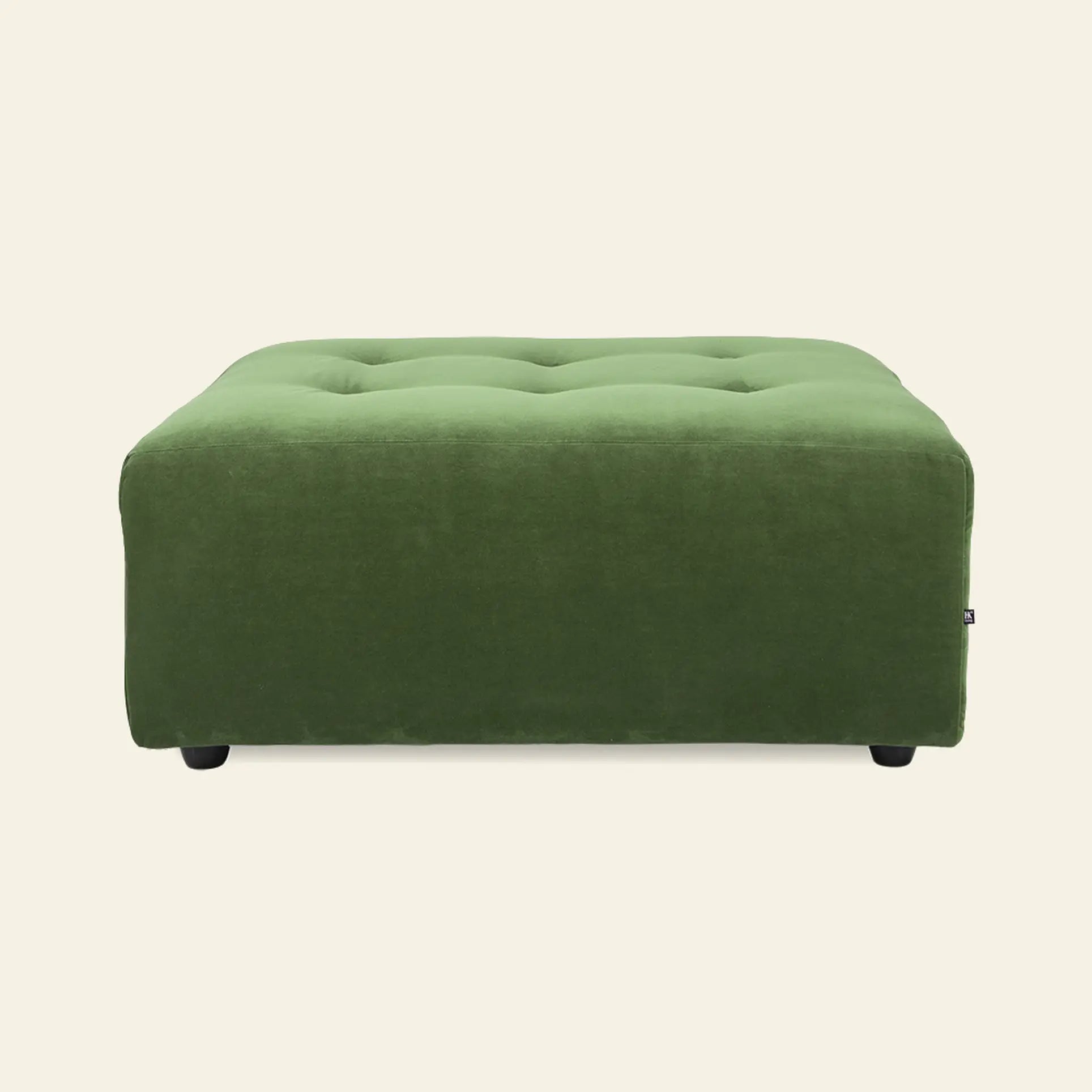 A square, green, tufted HKliving Vint Couch Hocker with a soft velvet-like feel, shown on an off-white background—ideal as flexible seating to pair with the HKliving Vint sofa or other modular pieces.