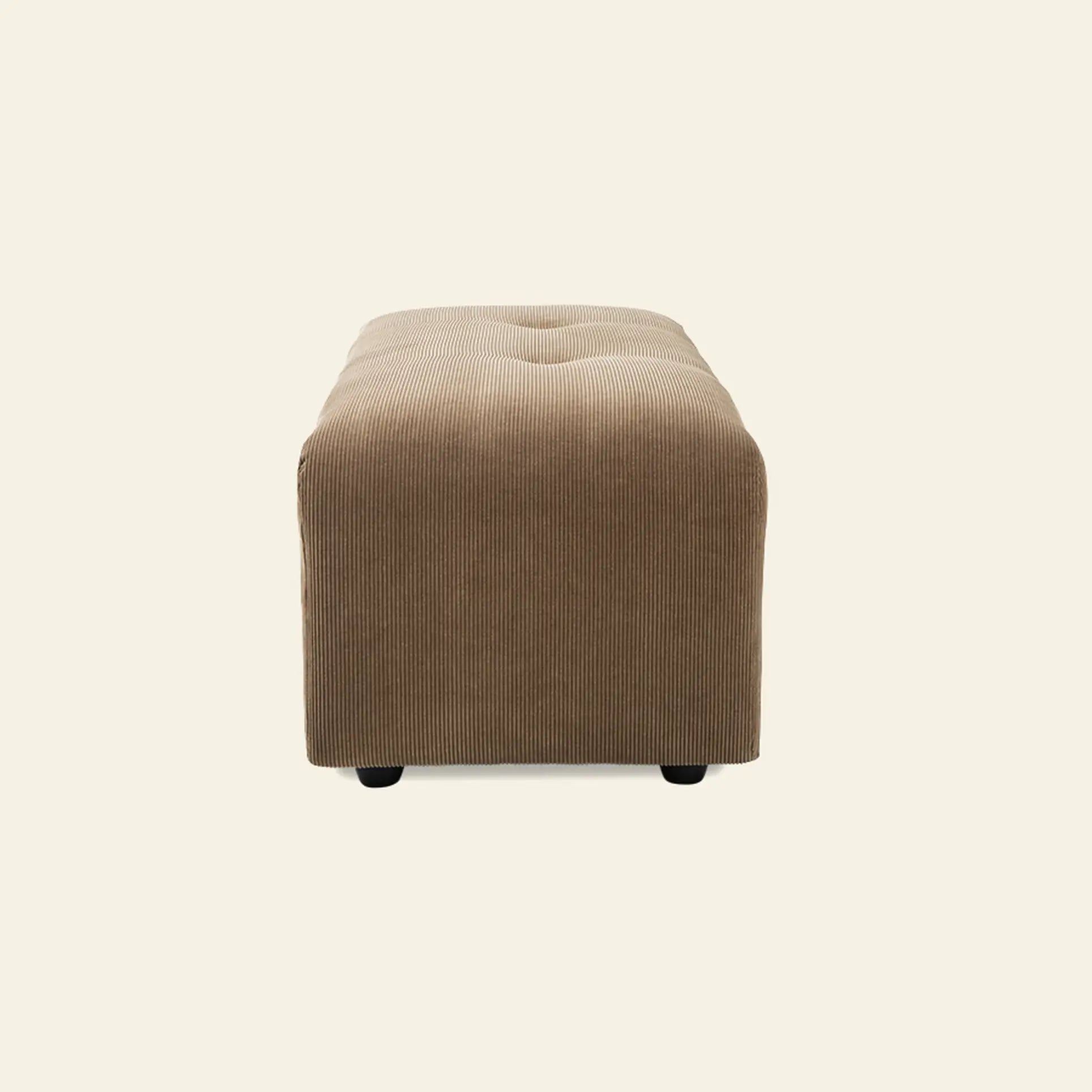 The HKliving Vint Couch, Hocker Small by HKliving is a light brown rectangular corduroy ottoman with rounded edges and subtle tufting—ideal for customizing your living space or pairing with the Vint sofa, shown against a plain light background.