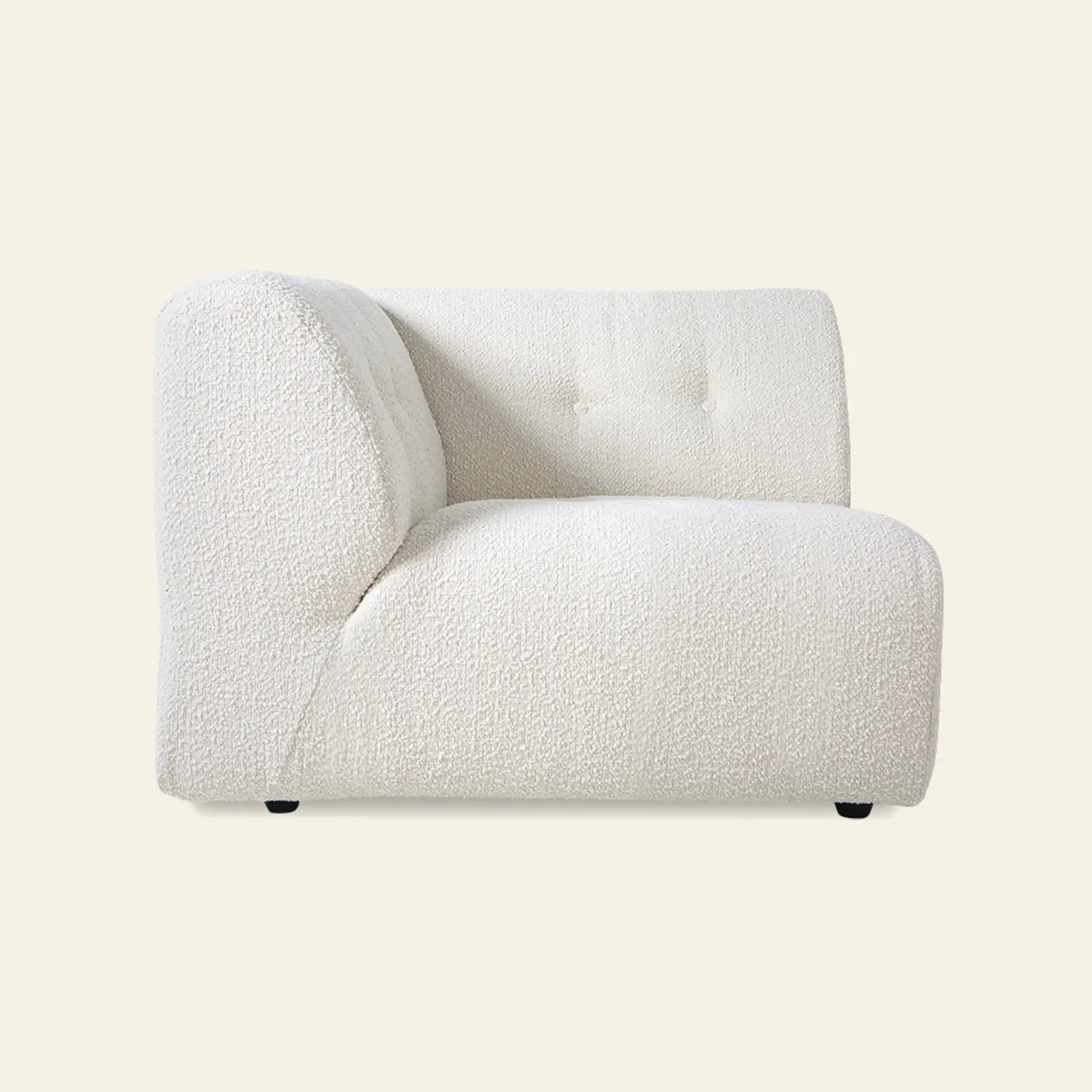 The HKliving Vint Couch, Left by HKliving features plush, textured white upholstery and a low, curved back—bringing modern style and comfort to any customizable living space, shown against a plain light background.