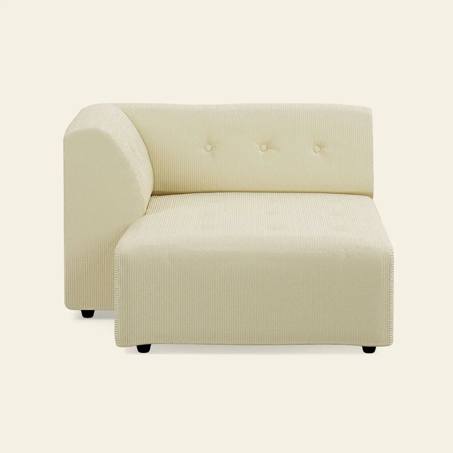 The HKliving Vint Couch, Left Divan by HKliving features modern cream-colored textured upholstery and three button tufts on the backrest, ideal for a customizable living space, shown on an off-white background.