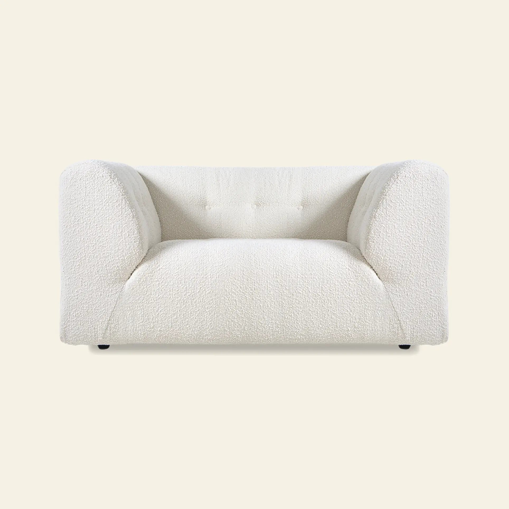 A modern, plush white armchair with rounded armrests and textured boucle fabric sits against a beige background—ideal for pairing with your HKliving Vint Couch or Loveseat to create a personalized living space.
