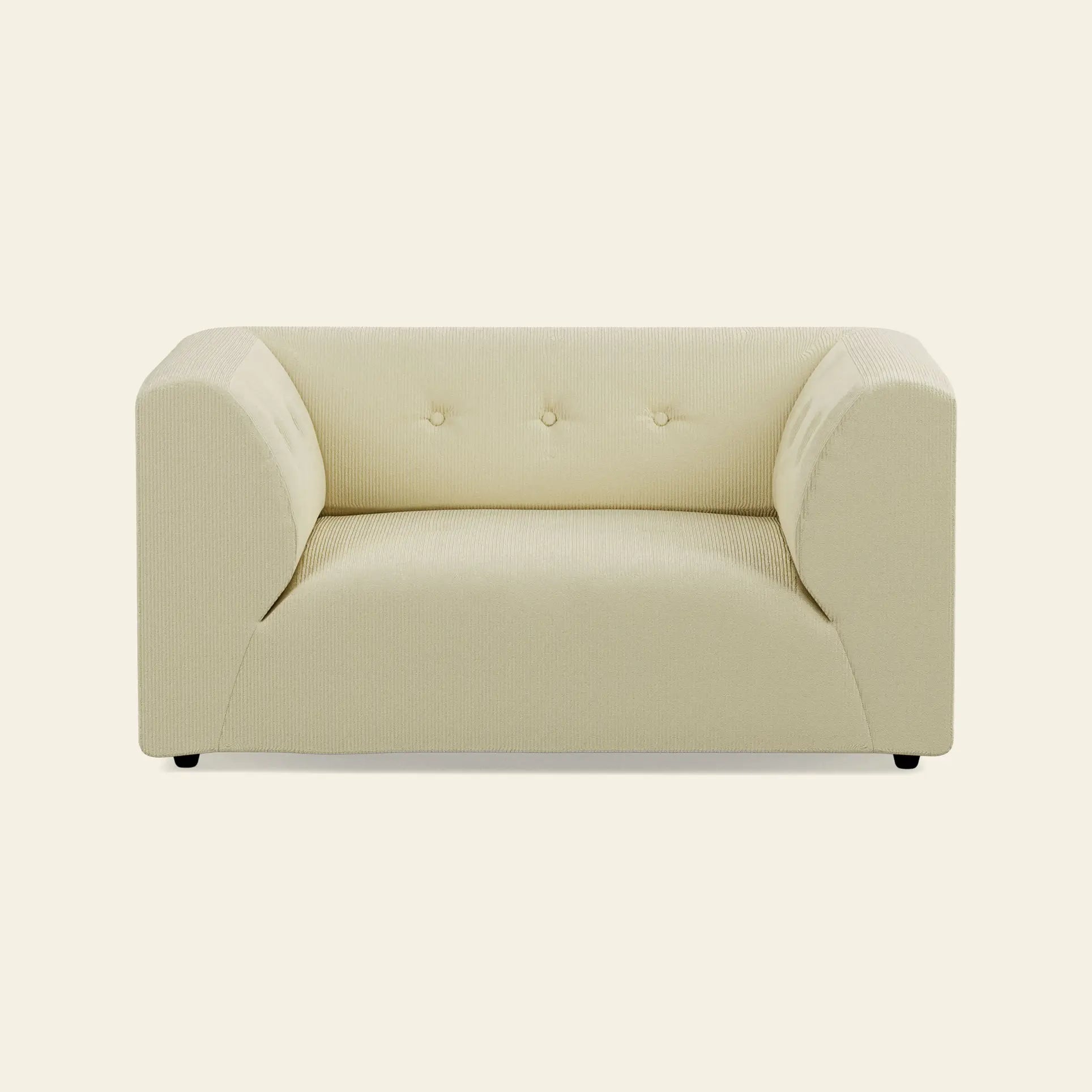 The HKliving Vint Couch Loveseat by HKliving features a modern, cream-tone boxy design with low arms and three backrest tufts—an ideal piece for customizable living spaces, shown here on an off-white background.