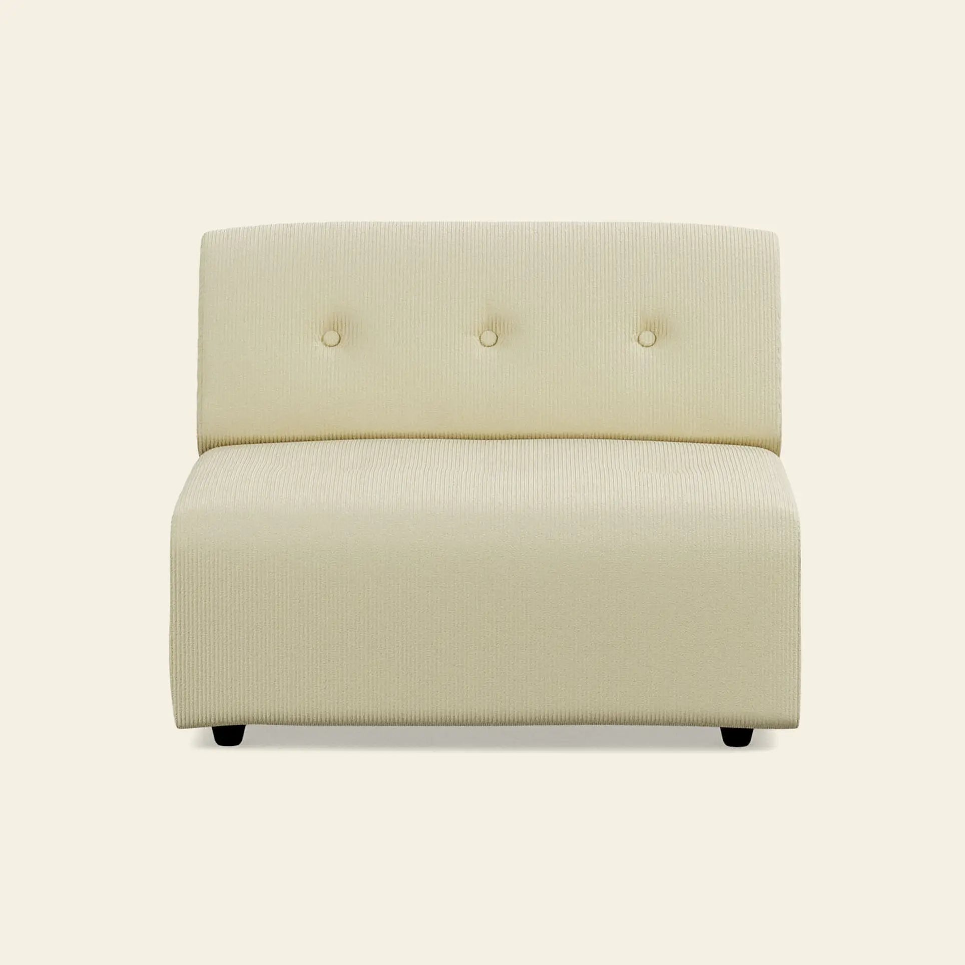 The HKliving Vint Couch, Middle by HKliving is a modern, armless beige accent chair with three button tufts, customizable seating, and textured fabric upholstery, displayed against a plain light background.