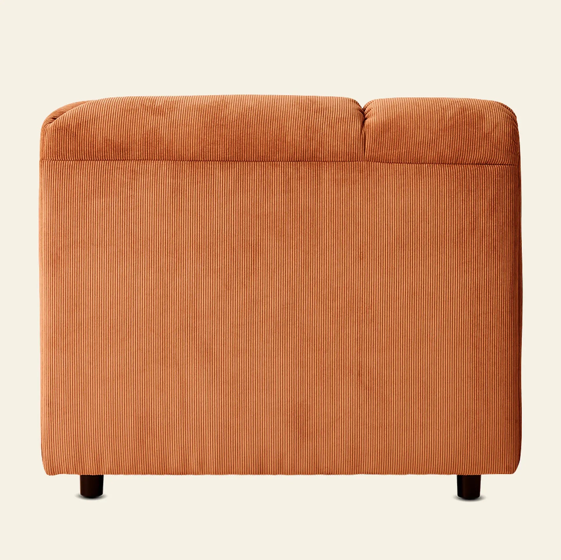 A back view of the HKliving Wave Couch, Corner in orange corduroy upholstery with short black legs, by HKliving—modern living room furniture set against a plain light background.